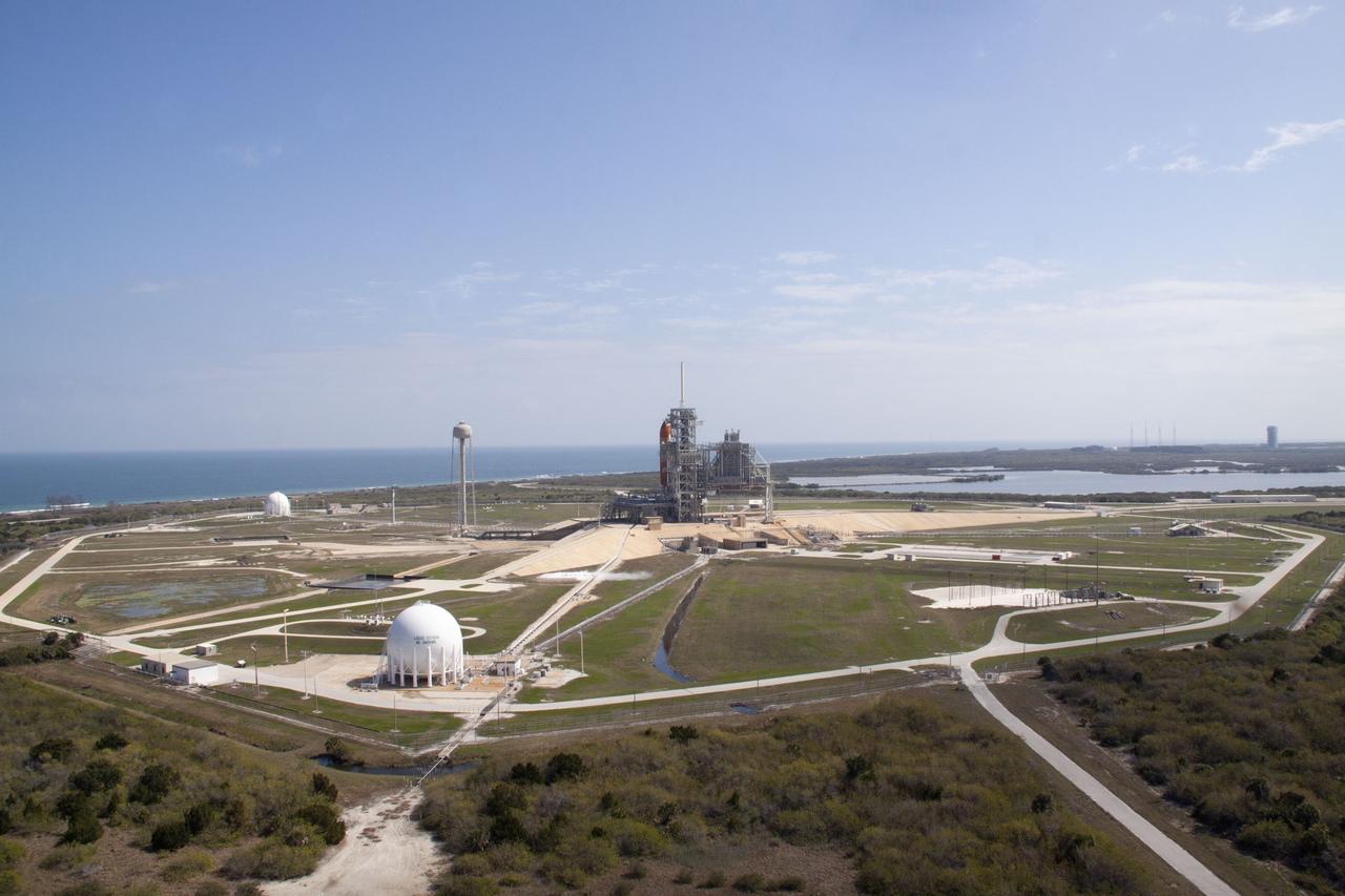 CAPE CANAVERAL, Fla. -- On Launch Pad 39A at NASA's Kennedy Space Center in Florida, space shuttle Discovery awaits the liftoff of its final scheduled mission on what is shaping up to be a picturesque day.    Liftoff is set for 4:50 p.m. EST on Feb. 24. Discovery and its six-member STS-133 crew will deliver the Permanent Multipurpose Module, packed with supplies and critical spare parts, as well as Robonaut 2, the dexterous humanoid astronaut helper, to the International Space Station. Discovery, which will fly its 39th mission, is scheduled to be retired following STS-133. This will be the 133rd Space Shuttle Program mission and the 35th shuttle voyage to the space station. For more information on the STS-133 mission, visit www.nasa.gov/mission_pages/shuttle/shuttlemissions/sts133/. Photo credit: NASA/Jack Pfaller
