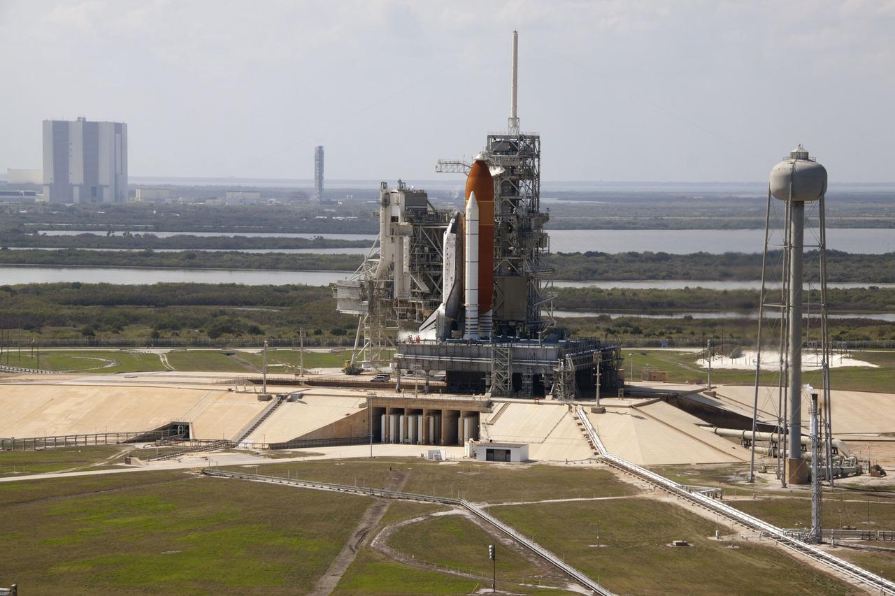 CAPE CANAVERAL, Fla. -- On Launch Pad 39A at NASA's Kennedy Space Center in Florida, space shuttle Discovery awaits the liftoff of its final scheduled mission on what is shaping up to be a picturesque day.    Liftoff is set for 4:50 p.m. EST on Feb. 24. Discovery and its six-member STS-133 crew will deliver the Permanent Multipurpose Module, packed with supplies and critical spare parts, as well as Robonaut 2, the dexterous humanoid astronaut helper, to the International Space Station. Discovery, which will fly its 39th mission, is scheduled to be retired following STS-133. This will be the 133rd Space Shuttle Program mission and the 35th shuttle voyage to the space station. For more information on the STS-133 mission, visit www.nasa.gov/mission_pages/shuttle/shuttlemissions/sts133/. Photo credit: NASA/Jack Pfaller