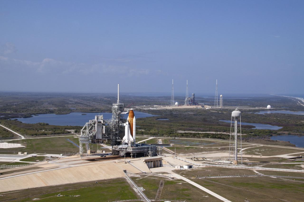 CAPE CANAVERAL, Fla. -- On Launch Pad 39A at NASA's Kennedy Space Center in Florida, space shuttle Discovery awaits the liftoff of its final scheduled mission on what is shaping up to be a picturesque day.    Liftoff is set for 4:50 p.m. EST on Feb. 24. Discovery and its six-member STS-133 crew will deliver the Permanent Multipurpose Module, packed with supplies and critical spare parts, as well as Robonaut 2, the dexterous humanoid astronaut helper, to the International Space Station. Discovery, which will fly its 39th mission, is scheduled to be retired following STS-133. This will be the 133rd Space Shuttle Program mission and the 35th shuttle voyage to the space station. For more information on the STS-133 mission, visit www.nasa.gov/mission_pages/shuttle/shuttlemissions/sts133/. Photo credit: NASA/Jack Pfaller