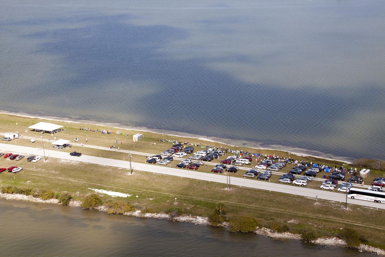 CAPE CANAVERAL, Fla. -- Crowds fill the areas along the NASA Causeway at NASA's Kennedy Space Center to watch space shuttle Discovery lift off on its final scheduled mission from Launch Pad 39A.        Liftoff is set for 4:50 p.m. EST on Feb. 24. Discovery and its six-member STS-133 crew will deliver the Permanent Multipurpose Module, packed with supplies and critical spare parts, as well as Robonaut 2, the dexterous humanoid astronaut helper, to the International Space Station. Discovery, which will fly its 39th mission, is scheduled to be retired following STS-133. This will be the 133rd Space Shuttle Program mission and the 35th shuttle voyage to the space station. For more information on the STS-133 mission, visit www.nasa.gov/mission_pages/shuttle/shuttlemissions/sts133/. Photo credit: NASA/Jack Pfaller