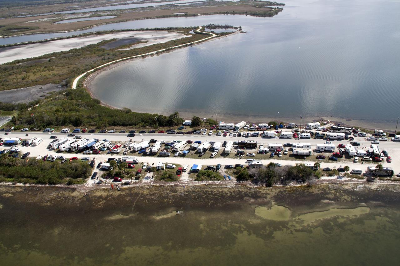 CAPE CANAVERAL, Fla. -- Folks from across the country camped out in communities surrounding NASA's Kennedy Space Center in Florida to witness space shuttle Discovery make history by lifting off on its final scheduled mission from Launch Pad 39A. Seen here, is State Road 406, also known as the A. Max Brewer Causeway, in Titusville, Fla. Liftoff is set for 4:50 p.m. EST on Feb. 24. Discovery and its six-member STS-133 crew will deliver the Permanent Multipurpose Module, packed with supplies and critical spare parts, as well as Robonaut 2, the dexterous humanoid astronaut helper, to the International Space Station. Discovery, which will fly its 39th mission, is scheduled to be retired following STS-133. This will be the 133rd Space Shuttle Program mission and the 35th shuttle voyage to the space station. For more information on the STS-133 mission, visit www.nasa.gov/mission_pages/shuttle/shuttlemissions/sts133/. Photo credit: NASA/Jack Pfaller