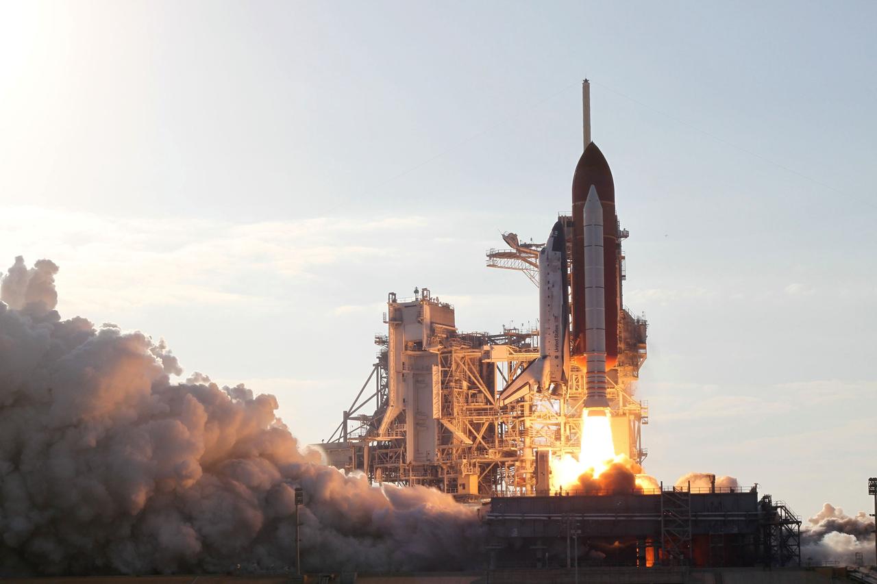 CAPE CANAVERAL, Fla. -- Rising on twin columns of fire and creating rolling clouds of smoke and steam, space shuttle Discovery lifts off Launch Pad 39A at NASA's Kennedy Space Center in Florida on a picturesque, warm, late February afternoon. Launch of the STS-133 mission was at 4:53 p.m. EST on Feb. 24. Discovery and its six-member crew are on a mission to deliver the Permanent Multipurpose Module, packed with supplies and critical spare parts, as well as Robonaut 2, the dexterous humanoid astronaut helper, to the International Space Station. Discovery is making its 39th mission and is scheduled to be retired following STS-133. This is the 133rd Space Shuttle Program mission and the 35th shuttle voyage to the space station. For more information on the STS-133 mission, visit www.nasa.gov/mission_pages/shuttle/shuttlemissions/sts133/. Photo credit: NASA