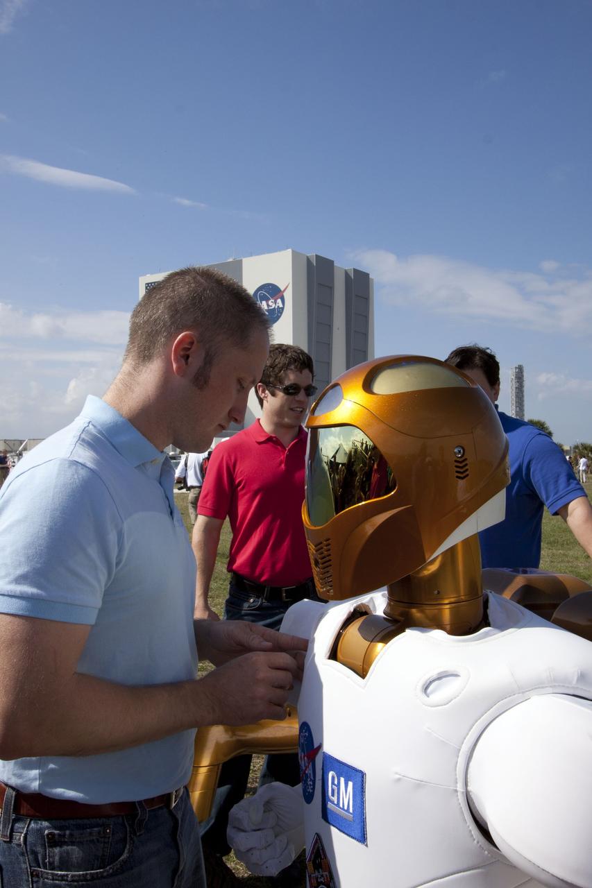 CAPE CANAVERAL, Fla. -- At NASA's Kennedy Space Center in Florida, technicians prepare a working model of the dexterous humanoid astronaut helper, Robonaut 2, for the media to check out before space shuttle Discovery's final flight on the STS-133 mission. Discovery and its six-member crew will deliver the Permanent Multipurpose Module, packed with supplies and critical spare parts, as well as Robonaut 2 to the International Space Station. For more information on the STS-133 mission, visit www.nasa.gov/mission_pages/shuttle/shuttlemissions/sts133/. Photo Credit: NASA/Troy Cryder