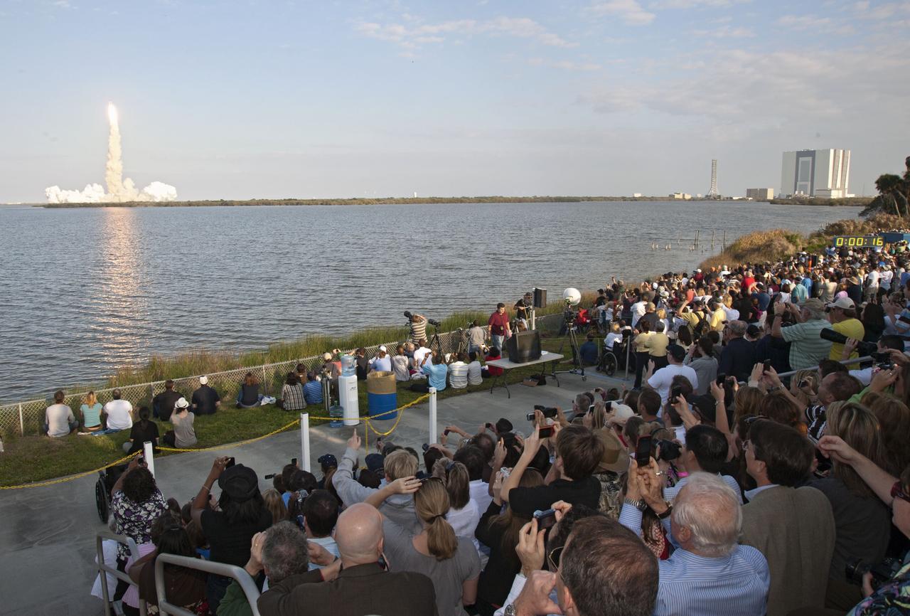 CAPE CANAVERAL, Fla. -- From the Banana River Creek VIP viewing area at NASA's Kennedy Space Center in Florida, spectators watch space shuttle Discovery's lift off from Launch Pad 39A on its final mission to the International Space Station.    Discovery lifted off at 4:53 p.m. EST on Feb. 24. The six-member STS-133 crew will deliver the Permanent Multipurpose Module, supplies and critical spare parts, as well as Robonaut 2, the dexterous humanoid astronaut helper, to the station. This is the 133rd Space Shuttle Program mission and the 35th shuttle voyage to the space station. For more information on the STS-133 mission, visit www.nasa.gov/mission_pages/shuttle/shuttlemissions/sts133/. Photo credit: NASA/Ben Cooper