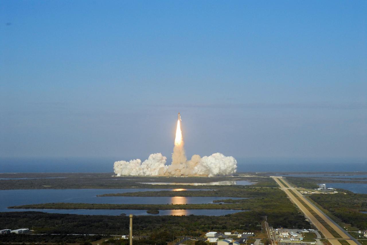 CAPE CANAVERAL, Fla. -- Taken from the roof of the Vehicle Assembly Building at NASA's Kennedy Space Center in Florida, space shuttle Discovery lifts off Launch Pad 39A atop twin columns of fire, creating rolling clouds of smoke and steam in its track. Launch of the STS-133 mission was at 4:53 p.m. EST on Feb. 24.           Discovery and its six-member crew are on a mission to deliver the Permanent Multipurpose Module, packed with supplies and critical spare parts, as well as Robonaut 2, the dexterous humanoid astronaut helper, to the International Space Station. Discovery is making its 39th mission and is scheduled to be retired following STS-133. This is the 133rd Space Shuttle Program mission, the 35th shuttle voyage to the space station and Discovery's final mission. For more information on the STS-133 mission, visit www.nasa.gov/mission_pages/shuttle/shuttlemissions/sts133/. Photo credit: NASA/Jeff Marino
