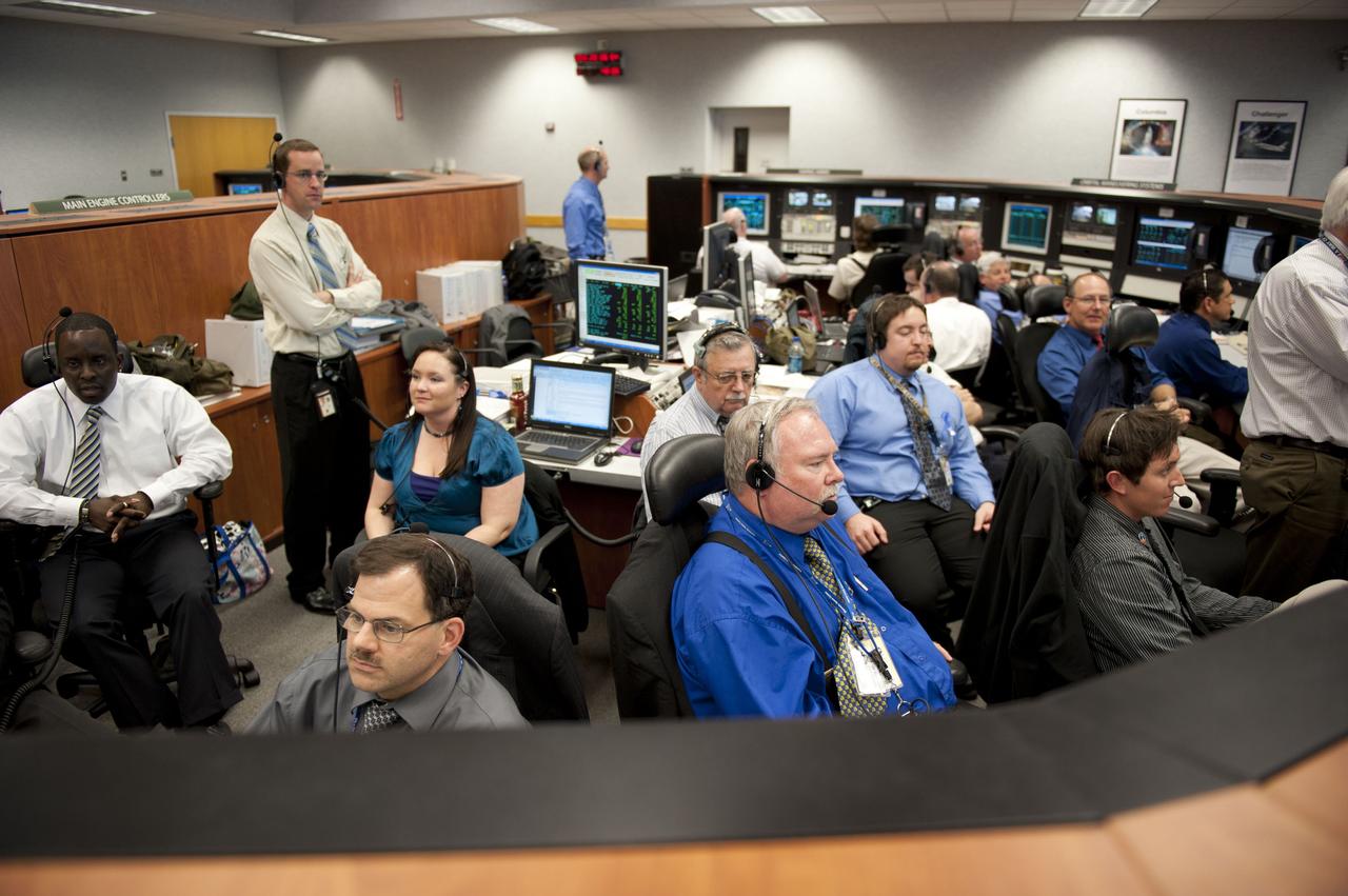 CAPE CANAVERAL, Fla. -- In Firing Room 4 of the Launch Control Center at NASA's Kennedy Space Center in Florida, launch controllers monitor the countdown to launch of space shuttle Discovery on its STS-133 mission to the International Space Station.       Discovery and its six-member crew are on a mission to deliver the Permanent Multipurpose Module, packed with supplies and critical spare parts, as well as Robonaut 2, the dexterous humanoid astronaut helper, to the orbiting outpost. Discovery is making its 39th mission and is scheduled to be retired following STS-133. This is the 133rd Space Shuttle Program mission and the 35th shuttle voyage to the space station. For more information on the STS-133 mission, visit www.nasa.gov/mission_pages/shuttle/shuttlemissions/sts133/. Photo credit: NASA/Kim Shiflett