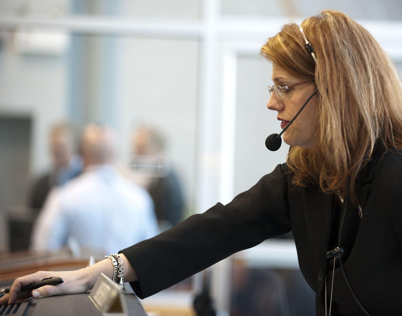 CAPE CANAVERAL, Fla. -- In Firing Room 4 of the Launch Control Center at NASA's Kennedy Space Center in Florida, STS-133 Assistant Shuttle Launch Director and Lead NASA Test Director Charlie Blackwell-Thompson monitors the countdown to launch of space shuttle Discovery on its STS-133 mission to the International Space Station.      Discovery and its six-member crew are on a mission to deliver the Permanent Multipurpose Module, packed with supplies and critical spare parts, as well as Robonaut 2, the dexterous humanoid astronaut helper, to the orbiting outpost. Discovery is making its 39th mission and is scheduled to be retired following STS-133. This is the 133rd Space Shuttle Program mission and the 35th shuttle voyage to the space station. For more information on the STS-133 mission, visit www.nasa.gov/mission_pages/shuttle/shuttlemissions/sts133/. Photo credit: NASA/Kim Shiflett