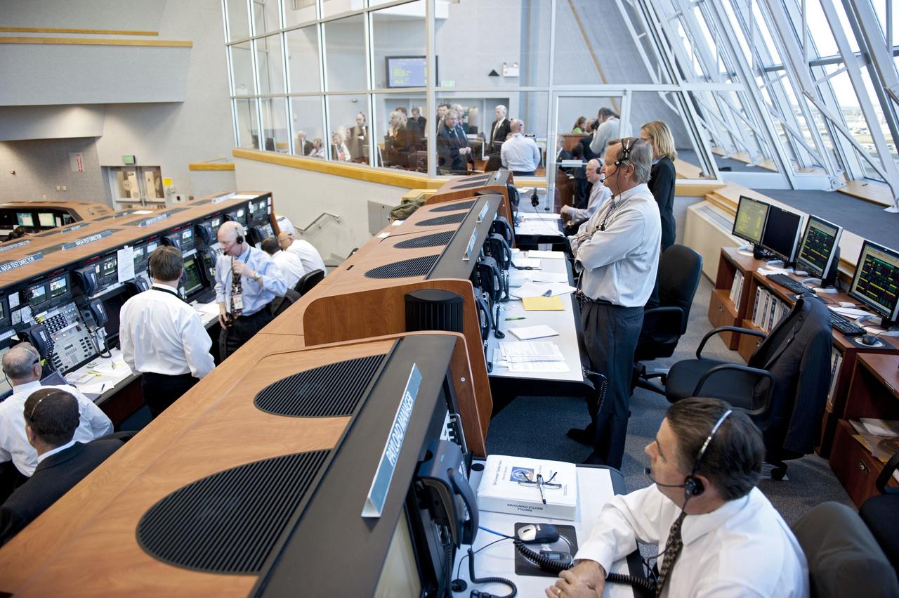CAPE CANAVERAL, Fla. -- In Firing Room 4 of the Launch Control Center at NASA's Kennedy Space Center in Florida, the launch team monitor the countdown to launch of space shuttle Discovery on its STS-133 mission to the International Space Station.           Discovery and its six-member crew are on a mission to deliver the Permanent Multipurpose Module, packed with supplies and critical spare parts, as well as Robonaut 2, the dexterous humanoid astronaut helper, to the orbiting outpost. Discovery is making its 39th mission and is scheduled to be retired following STS-133. This is the 133rd Space Shuttle Program mission and the 35th shuttle voyage to the space station. For more information on the STS-133 mission, visit www.nasa.gov/mission_pages/shuttle/shuttlemissions/sts133/. Photo credit: NASA/Kim Shiflett