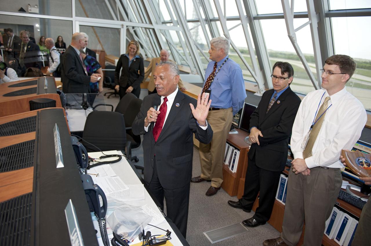 CAPE CANAVERAL, Fla. -- In Firing Room 4 of the Launch Control Center at NASA's Kennedy Space Center in Florida, NASA Administrator Charlie Bolden congratulates the launch team after the successful liftoff of space shuttle Discovery on its STS-133 mission to the International Space Station.       Discovery and its six-member crew are on a mission to deliver the Permanent Multipurpose Module, packed with supplies and critical spare parts, as well as Robonaut 2, the dexterous humanoid astronaut helper, to the orbiting outpost. Discovery is making its 39th mission and is scheduled to be retired following STS-133. This is the 133rd Space Shuttle Program mission and the 35th shuttle voyage to the space station. For more information on the STS-133 mission, visit www.nasa.gov/mission_pages/shuttle/shuttlemissions/sts133/. Photo credit: NASA/Kim Shiflett