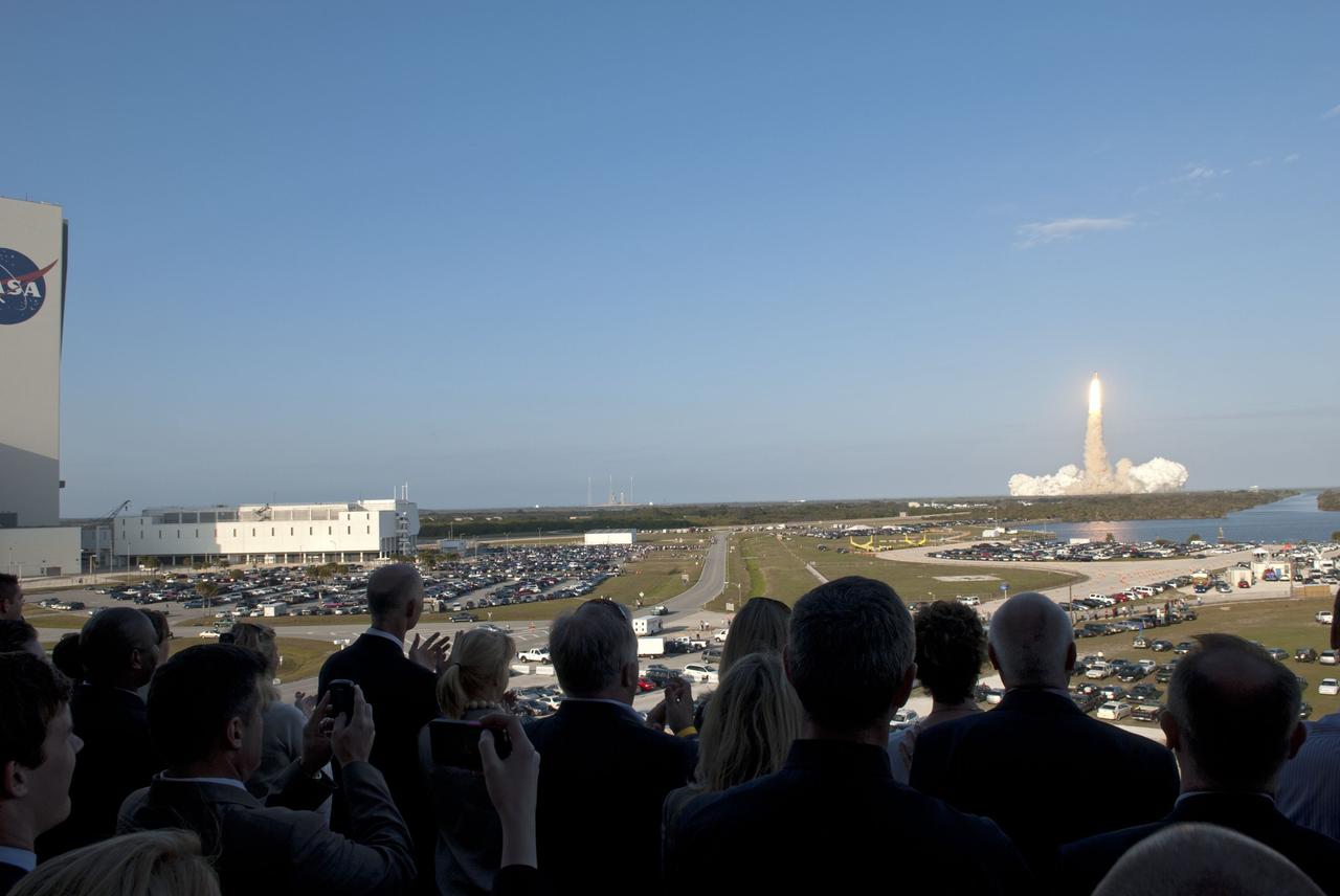 CAPE CANAVERAL, Fla. -- From the terrace of the VIP viewing area at the Operations Support Building II at NASA's Kennedy Space Center in Florida, space shuttle Discovery is seen lifting off from Launch Pad 39A on its final mission to the International Space Station. Discovery lifted off at 4:53 p.m. EST on Feb. 24. The six-member STS-133 crew will deliver the Permanent Multipurpose Module, supplies and critical spare parts, as well as Robonaut 2, the dexterous humanoid astronaut helper, to the station. This is the 133rd Space Shuttle Program mission and the 35th shuttle voyage to the space station. For more information on the STS-133 mission, visit www.nasa.gov/mission_pages/shuttle/shuttlemissions/sts133/. Photo credit: NASA/Jim Grossmann
