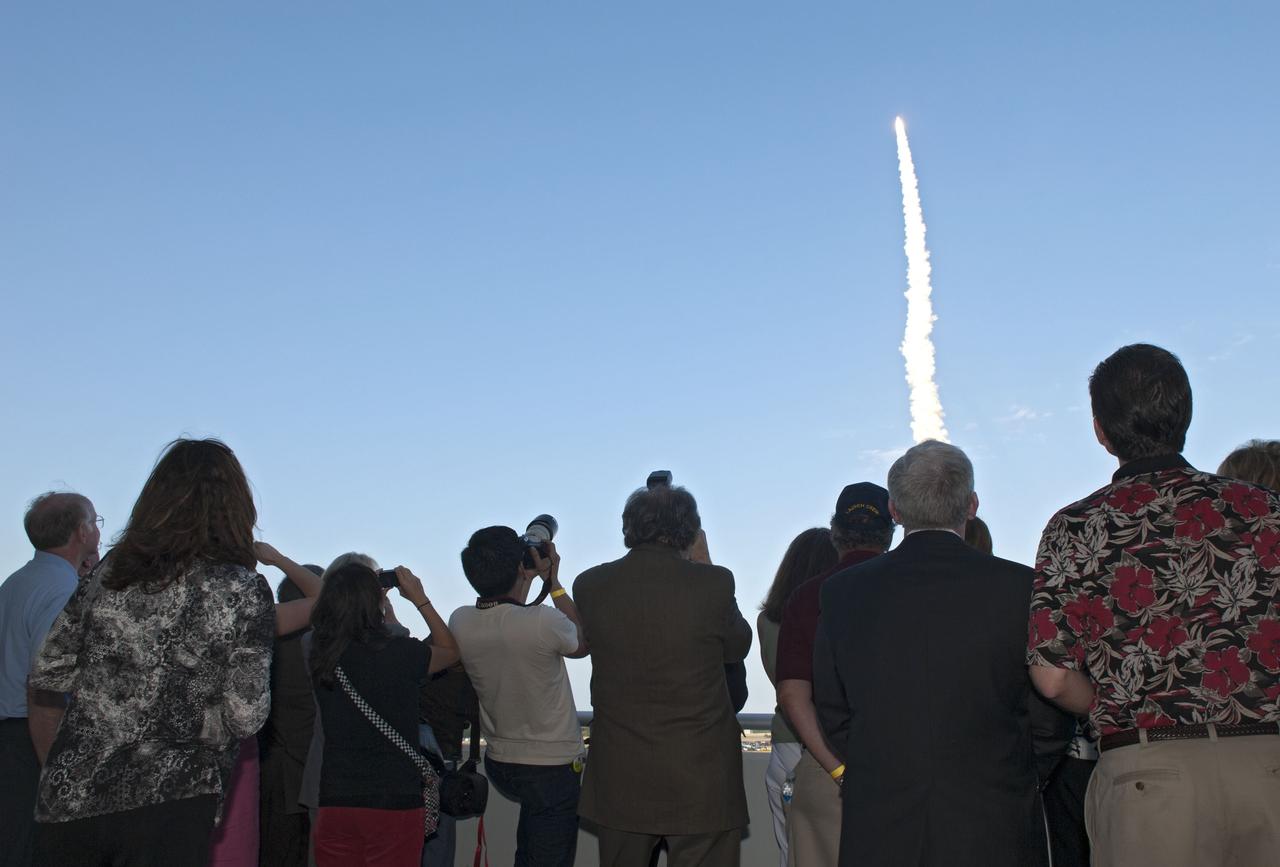 CAPE CANAVERAL, Fla. -- From the terrace of the VIP viewing area at the Operations Support Building II at NASA's Kennedy Space Center in Florida, space shuttle Discovery is seen lifting off from Launch Pad 39A on its final mission to the International Space Station. Discovery lifted off at 4:53 p.m. EST on Feb. 24. The six-member STS-133 crew will deliver the Permanent Multipurpose Module, supplies and critical spare parts, as well as Robonaut 2, the dexterous humanoid astronaut helper, to the station. This is the 133rd Space Shuttle Program mission and the 35th shuttle voyage to the space station. For more information on the STS-133 mission, visit www.nasa.gov/mission_pages/shuttle/shuttlemissions/sts133/. Photo credit: NASA/Jim Grossmann
