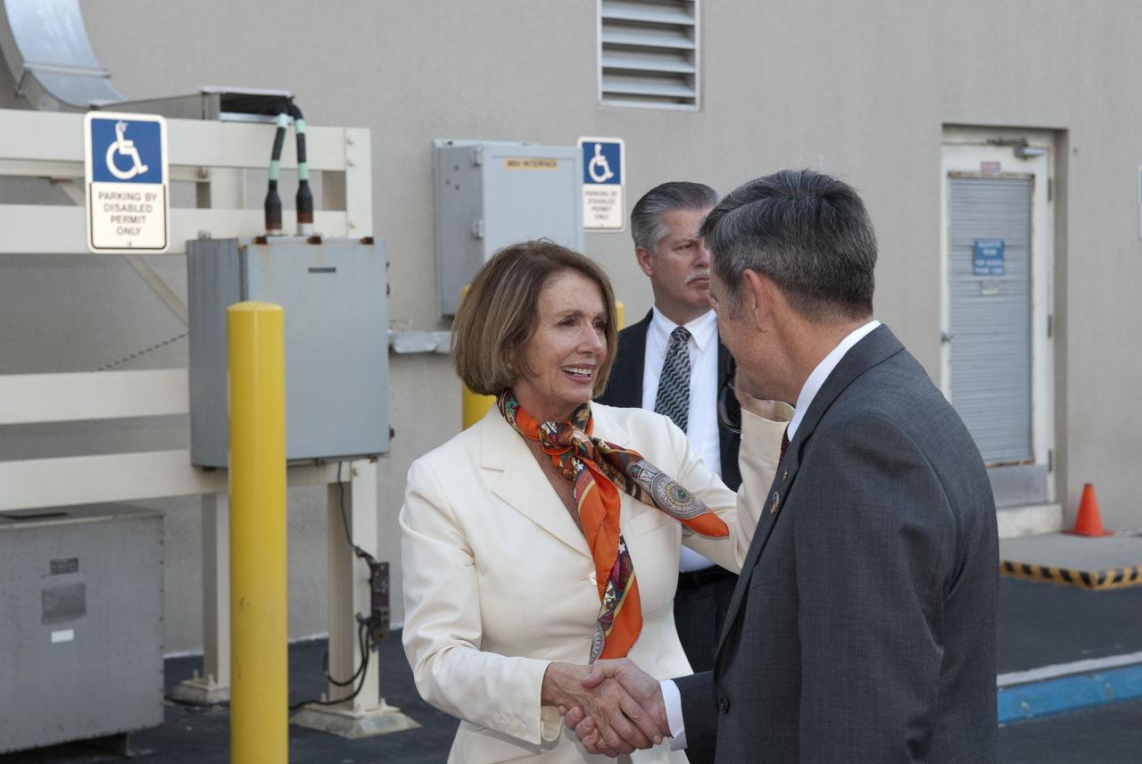 CAPE CANAVERAL, Fla. -- House Of Representatives Democratic Leader Nancy Pelosi, from California's 8th District, is greeted by NASA Kennedy Space Center Director Robert Cabana. Pelosi is at Florida's space center to witness space shuttle Discovery make history as it lifts off on its final scheduled mission from Launch Pad 39A. While at the center, Pelosi attended a presentation in the Operations Support Building II and toured Orbiter Processing Facilities 1 and 2 where shuttles Atlantis and Endeavour are being prepared for their final missions respectively. Discovery and its six-member STS-133 crew will deliver the Permanent Multipurpose Module, packed with supplies and critical spare parts, as well as Robonaut 2, the dexterous humanoid astronaut helper, to the International Space Station. Discovery will make its 39th mission and is scheduled to be retired following STS-133. This will be the 133rd Space Shuttle Program mission and the 35th shuttle voyage to the space station. For more information on the STS-133 mission, visit www.nasa.gov/mission_pages/shuttle/shuttlemissions/sts133/. Photo credit: NASA/Jim Grossmann