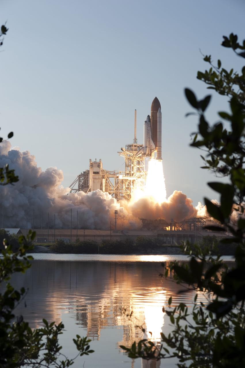 CAPE CANAVERAL, Fla. -- An exhaust cloud billows around Launch Pad 39A at NASA's Kennedy Space Center in Florida as space shuttle Discovery lifts off at 4:53 p.m. EST to begin the STS-133 mission and its final flight to the International Space Station.        Discovery and its six-member crew will deliver the Permanent Multipurpose Module, packed with supplies and critical spare parts, as well as Robonaut 2, the dexterous humanoid astronaut helper, to the orbiting outpost. Discovery is flying on its 39th mission and is scheduled to be retired following STS-133. This is the 133rd Space Shuttle Program mission and the 35th shuttle voyage to the space station. For more information on the STS-133 mission, visit www.nasa.gov/mission_pages/shuttle/shuttlemissions/sts133/. Photo credit: NASA/Sandra Joseph and Kevin O'Connell