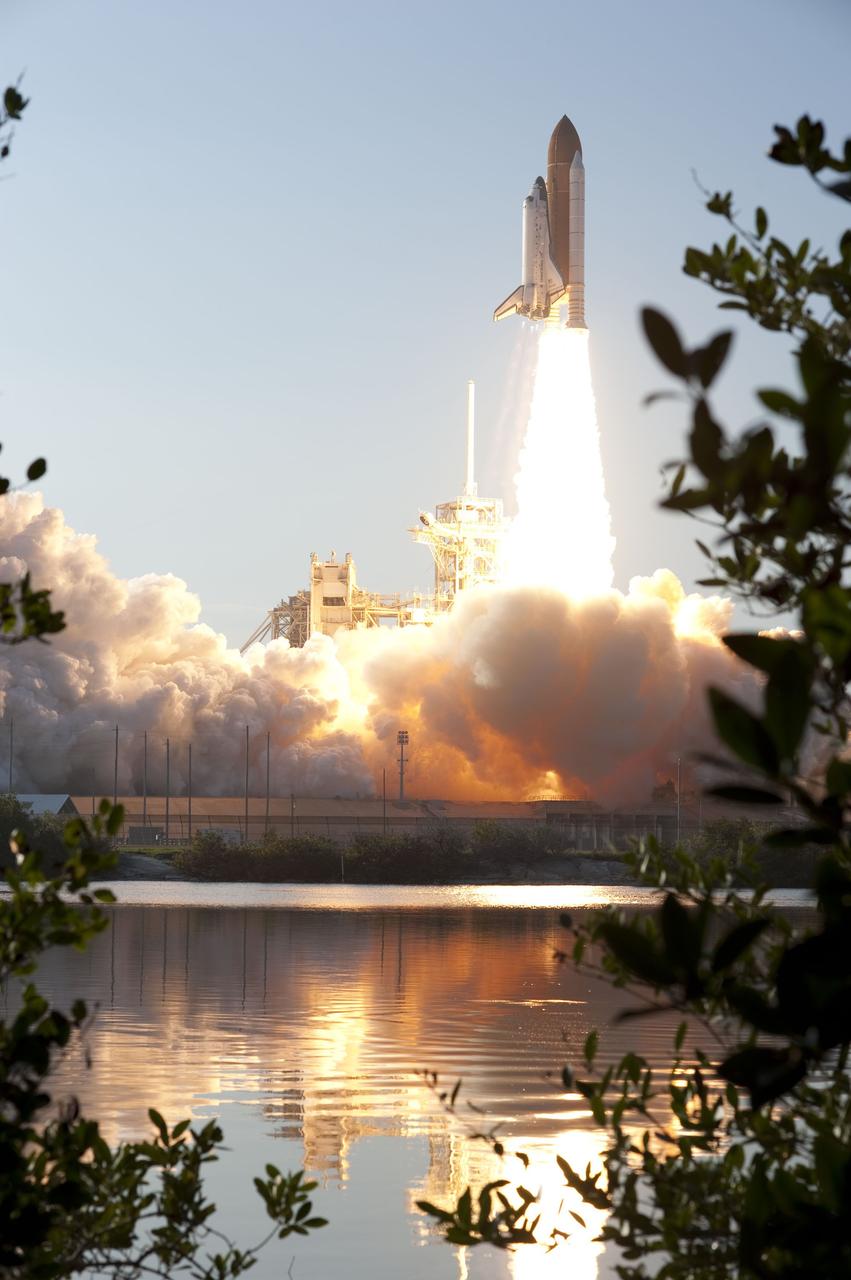 CAPE CANAVERAL, Fla. -- An exhaust cloud billows around Launch Pad 39A at NASA's Kennedy Space Center in Florida as space shuttle Discovery lifts off at 4:53 p.m. EST to begin the STS-133 mission and its final flight to the International Space Station.        Discovery and its six-member crew will deliver the Permanent Multipurpose Module, packed with supplies and critical spare parts, as well as Robonaut 2, the dexterous humanoid astronaut helper, to the orbiting outpost. Discovery is flying on its 39th mission and is scheduled to be retired following STS-133. This is the 133rd Space Shuttle Program mission and the 35th shuttle voyage to the space station. For more information on the STS-133 mission, visit www.nasa.gov/mission_pages/shuttle/shuttlemissions/sts133/. Photo credit: NASA/Sandra Joseph and Kevin O'Connell
