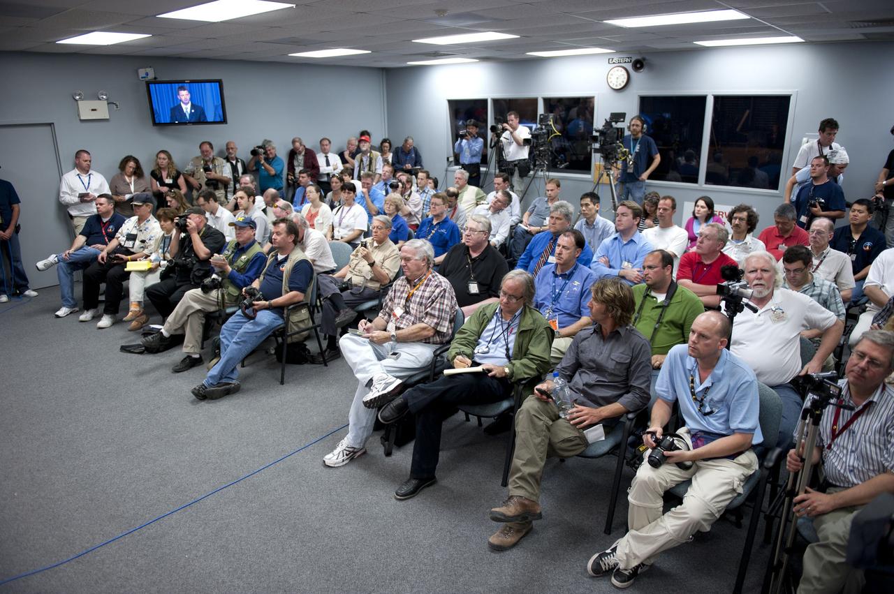 CAPE CANAVERAL, Fla. -- Media gather for a news conference held in the Press Site auditorium at NASA's Kennedy Space Center in Florida following today's successful launch of space shuttle Discovery. Shuttle Discovery lifted off at 4:53 p.m. EST.               The six-member crew will deliver the Permanent Multipurpose Module, packed with supplies and critical spare parts, as well as Robonaut 2, the dexterous humanoid astronaut helper, to the orbiting outpost. Discovery is flying on its 39th and final mission and is scheduled to be retired following STS-133. This is the 133rd Space Shuttle Program mission and the 35th shuttle voyage to the space station. For more information on the STS-133 mission, visit www.nasa.gov/mission_pages/shuttle/shuttlemissions/sts133/. Photo credit: NASA/Kim Shiflett