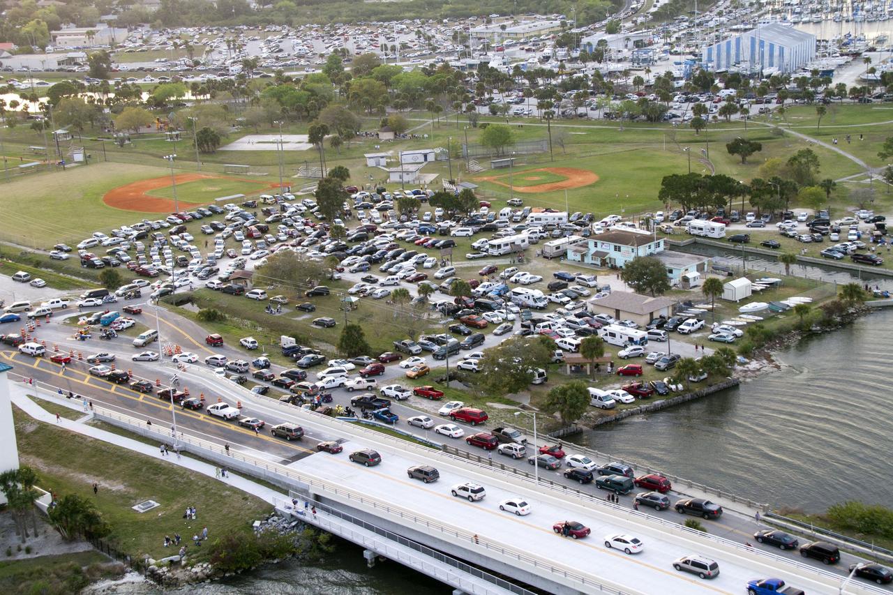 CAPE CANAVERAL, Fla. -- This image of State Road 406, also known as the A. Max Brewer Causeway and surrounding roadways in Titusville, Florida, was taken from a traffic survey helicopter after the successful launch of space shuttle Discovery at 4:53 p.m. EST on its final flight to the International Space Station. Discovery's six-member crew will deliver the Permanent Multipurpose Module, packed with supplies and critical spare parts, as well as Robonaut 2, the dexterous humanoid astronaut helper, to the orbiting outpost. Discovery is flying on its 39th and final mission and is scheduled to be retired following STS-133. This is the 133rd Space Shuttle Program mission and the 35th shuttle voyage to the space station. For more information on the STS-133 mission, visit www.nasa.gov/mission_pages/shuttle/shuttlemissions/sts133/. Photo credit: NASA/Jack Pfaller