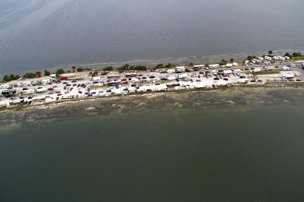 CAPE CANAVERAL, Fla. -- This image of State Road 406, also known as the A. Max Brewer Causeway in Titusville, Florida, was taken from a traffic survey helicopter after the successful launch of space shuttle Discovery at 4:53 p.m. EST on its final flight to the International Space Station. Discovery's six-member crew will deliver the Permanent Multipurpose Module, packed with supplies and critical spare parts, as well as Robonaut 2, the dexterous humanoid astronaut helper, to the orbiting outpost. Discovery is flying on its 39th and final mission and is scheduled to be retired following STS-133. This is the 133rd Space Shuttle Program mission and the 35th shuttle voyage to the space station. For more information on the STS-133 mission, visit www.nasa.gov/mission_pages/shuttle/shuttlemissions/sts133/. Photo credit: NASA/Jack Pfaller