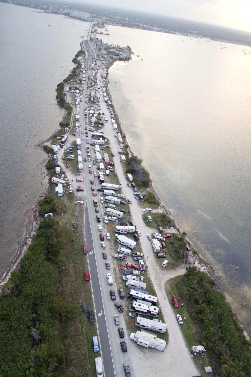 CAPE CANAVERAL, Fla. -- This image of State Road 406, also known as the A. Max Brewer Causeway in Titusville, Florida, was taken from a traffic survey helicopter after the successful launch of space shuttle Discovery at 4:53 p.m. EST on its final flight to the International Space Station. Discovery's six-member crew will deliver the Permanent Multipurpose Module, packed with supplies and critical spare parts, as well as Robonaut 2, the dexterous humanoid astronaut helper, to the orbiting outpost. Discovery is flying on its 39th and final mission and is scheduled to be retired following STS-133. This is the 133rd Space Shuttle Program mission and the 35th shuttle voyage to the space station. For more information on the STS-133 mission, visit www.nasa.gov/mission_pages/shuttle/shuttlemissions/sts133/. Photo credit: NASA/Jack Pfaller