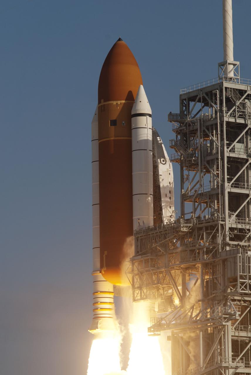 CAPE CANAVERAL, Fla. -- Space shuttle Discovery ignites for liftoff from Launch Pad 39A at NASA's Kennedy Space Center in Florida, beginning its final flight, the STS-133 mission. Launch to the International Space Station was at 4:53 p.m. EST.      Discovery and its six-member crew will deliver the Permanent Multipurpose Module, packed with supplies and critical spare parts, as well as Robonaut 2, the dexterous humanoid astronaut helper, to the orbiting outpost. Discovery is flying on its 39th mission and is scheduled to be retired following STS-133. This is the 133rd Space Shuttle Program mission and the 35th shuttle voyage to the space station. For more information on the STS-133 mission, visit www.nasa.gov/mission_pages/shuttle/shuttlemissions/sts133/. Photo credit: NASA/Rusty Backer and Michael Gayle