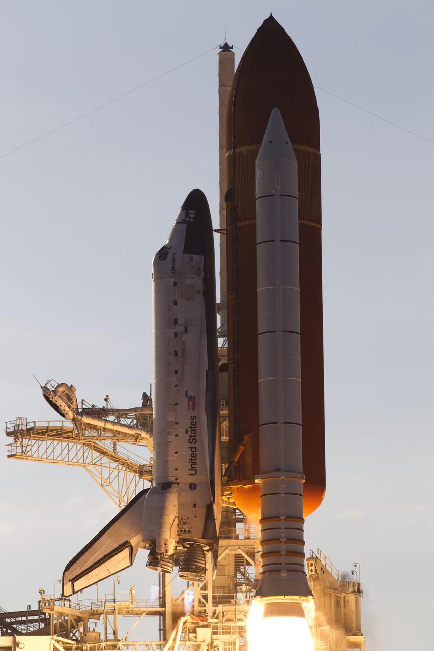 CAPE CANAVERAL, Fla. -- Space shuttle Discovery ignites for liftoff from Launch Pad 39A at NASA's Kennedy Space Center in Florida, beginning its final flight, the STS-133 mission, to the International Space Station. Launch was at 4:53 p.m. EST.          Discovery and its six-member crew will deliver the Permanent Multipurpose Module, packed with supplies and critical spare parts, as well as Robonaut 2, the dexterous humanoid astronaut helper, to the orbiting outpost. Discovery is flying on its 39th mission and is scheduled to be retired following STS-133. This is the 133rd Space Shuttle Program mission and the 35th shuttle voyage to the space station. For more information on the STS-133 mission, visit www.nasa.gov/mission_pages/shuttle/shuttlemissions/sts133/. Photo credit: NASA/Rusty Backer and Michael Gayle