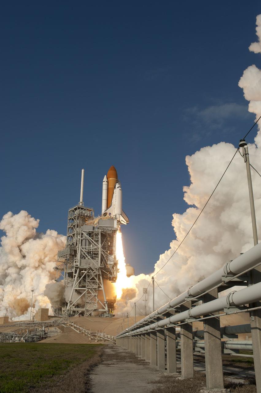 CAPE CANAVERAL, Fla. -- Space shuttle Discovery ignites for liftoff from Launch Pad 39A at NASA's Kennedy Space Center in Florida, beginning its final flight, the STS-133 mission. Launch to the International Space Station was at 4:53 p.m. EST.        Discovery and its six-member crew will deliver the Permanent Multipurpose Module, packed with supplies and critical spare parts, as well as Robonaut 2, the dexterous humanoid astronaut helper, to the orbiting outpost. Discovery is flying on its 39th mission and is scheduled to be retired following STS-133. This is the 133rd Space Shuttle Program mission and the 35th shuttle voyage to the space station. For more information on the STS-133 mission, visit www.nasa.gov/mission_pages/shuttle/shuttlemissions/sts133/. Photo credit: NASA/Sandra Joseph and Kevin O'Connell