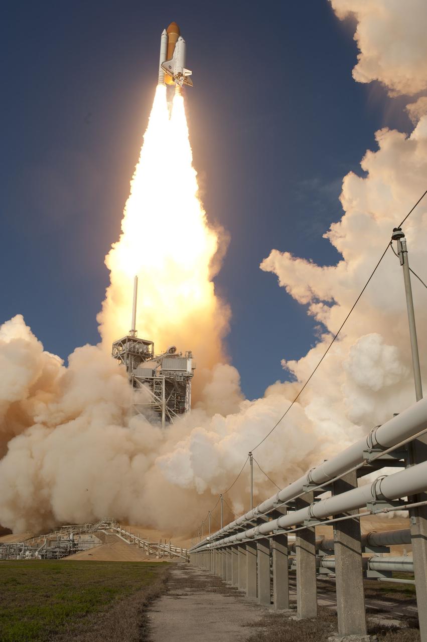 CAPE CANAVERAL, Fla. -- Space shuttle Discovery soars into space from Launch Pad 39A at NASA's Kennedy Space Center in Florida to begin its final flight, the STS-133 mission. Launch to the International Space Station was at 4:53 p.m. EST.      Discovery and its six-member crew will deliver the Permanent Multipurpose Module, packed with supplies and critical spare parts, as well as Robonaut 2, the dexterous humanoid astronaut helper, to the orbiting outpost. Discovery is flying on its 39th mission and is scheduled to be retired following STS-133. This is the 133rd Space Shuttle Program mission and the 35th shuttle voyage to the space station. For more information on the STS-133 mission, visit www.nasa.gov/mission_pages/shuttle/shuttlemissions/sts133/. Photo credit: NASA/Sandra Joseph and Kevin O'Connell