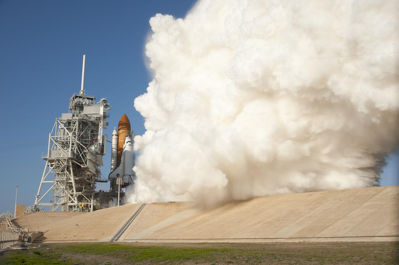 CAPE CANAVERAL, Fla. -- Smoke and steam billow around space shuttle Discovery and Launch Pad 39A at NASA's Kennedy Space Center in Florida, as the shuttle's solid rocket boosters and main engines ignite for lift off embarking on its final mission. Launch to the International Space Station was at 4:53 p.m. EST. Discovery and its six-member crew will deliver the Permanent Multipurpose Module, packed with supplies and critical spare parts, as well as Robonaut 2, the dexterous humanoid astronaut helper, to the orbiting outpost. Discovery is flying on its 39th mission and is scheduled to be retired following STS-133. This is the 133rd Space Shuttle Program mission and the 35th shuttle voyage to the space station. For more information on the STS-133 mission, visit www.nasa.gov/mission_pages/shuttle/shuttlemissions/sts133/. Photo credit: NASA/Tony Gray and Tom Farrar