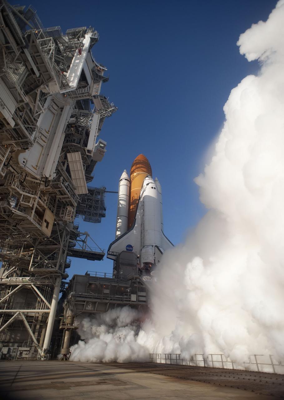 CAPE CANAVERAL, Fla. -- In a swirl of billowing steam, space shuttle Discovery ignites for liftoff on Launch Pad 39A at NASA's Kennedy Space Center in Florida beginning its final flight, the STS-133 mission, to the International Space Station. Launch was at 4:53 p.m. EST.      Discovery and its six-member crew will deliver the Permanent Multipurpose Module, packed with supplies and critical spare parts, as well as Robonaut 2, the dexterous humanoid astronaut helper, to the orbiting outpost. Discovery is flying on its 39th mission and is scheduled to be retired following STS-133. This is the 133rd Space Shuttle Program mission and the 35th shuttle voyage to the space station. For more information on the STS-133 mission, visit www.nasa.gov/mission_pages/shuttle/shuttlemissions/sts133/. Photo credit: NASA/Tony Gray and Tom Farrar
