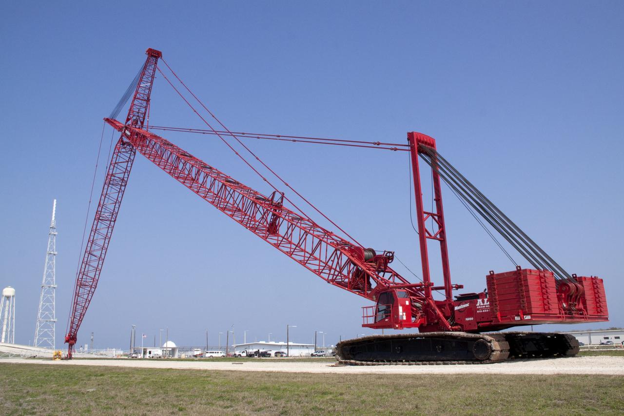 CAPE CANAVERAL, Fla. -- At NASA's Kennedy Space Center in Florida, a heavy-duty crane is slowly making its way to Launch Pad 39B, to continue deconstruction of the pad which is being restructured for future use. The new design will feature a "clean pad" for rockets to come with their own launcher, making it more versatile for a number of vehicles. For information on NASA's future plans, visit www.nasa.gov. Photo credit: NASA/Jack Pfaller