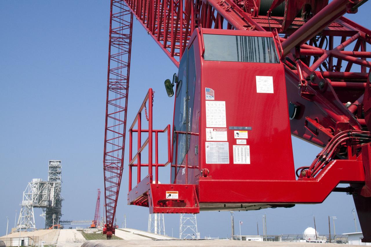CAPE CANAVERAL, Fla. -- At NASA's Kennedy Space Center in Florida, a heavy-duty crane is slowly making its way to Launch Pad 39B, to continue deconstruction of the pad which is being restructured for future use. The new design will feature a "clean pad" for rockets to come with their own launcher, making it more versatile for a number of vehicles. For information on NASA's future plans, visit www.nasa.gov. Photo credit: NASA/Jack Pfaller