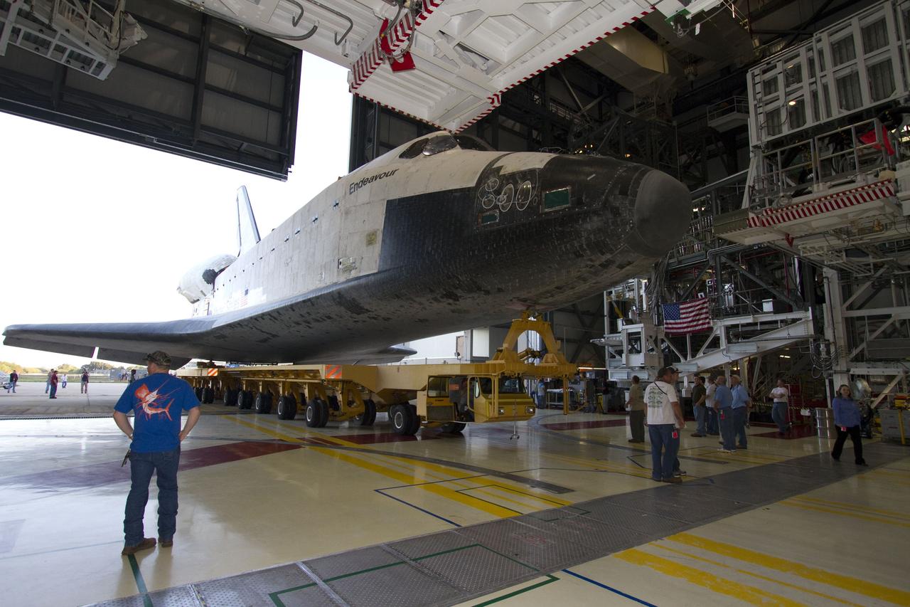 CAPE CANAVERAL, Fla. -- In Orbiter Processing Facility-2 at NASA’s Kennedy Space Center in Florida, workers prepare space shuttle Endeavour for its move, or "rollover," from its hangar to the Vehicle Assembly Building. Endeavour and its STS-134 crew will deliver the Express Logistics Carrier-3, Alpha Magnetic Spectrometer, spare parts, a high-pressure gas tank, additional spare parts for Dextre and micrometeoroid debris shields to the International Space Station. Launch is targeted for April 19 at 7:48 p.m. EDT. For more information visit, http://www.nasa.gov/mission_pages/shuttle/shuttlemissions/sts134/index.html. Photo credit: NASA/Jack Pfaller