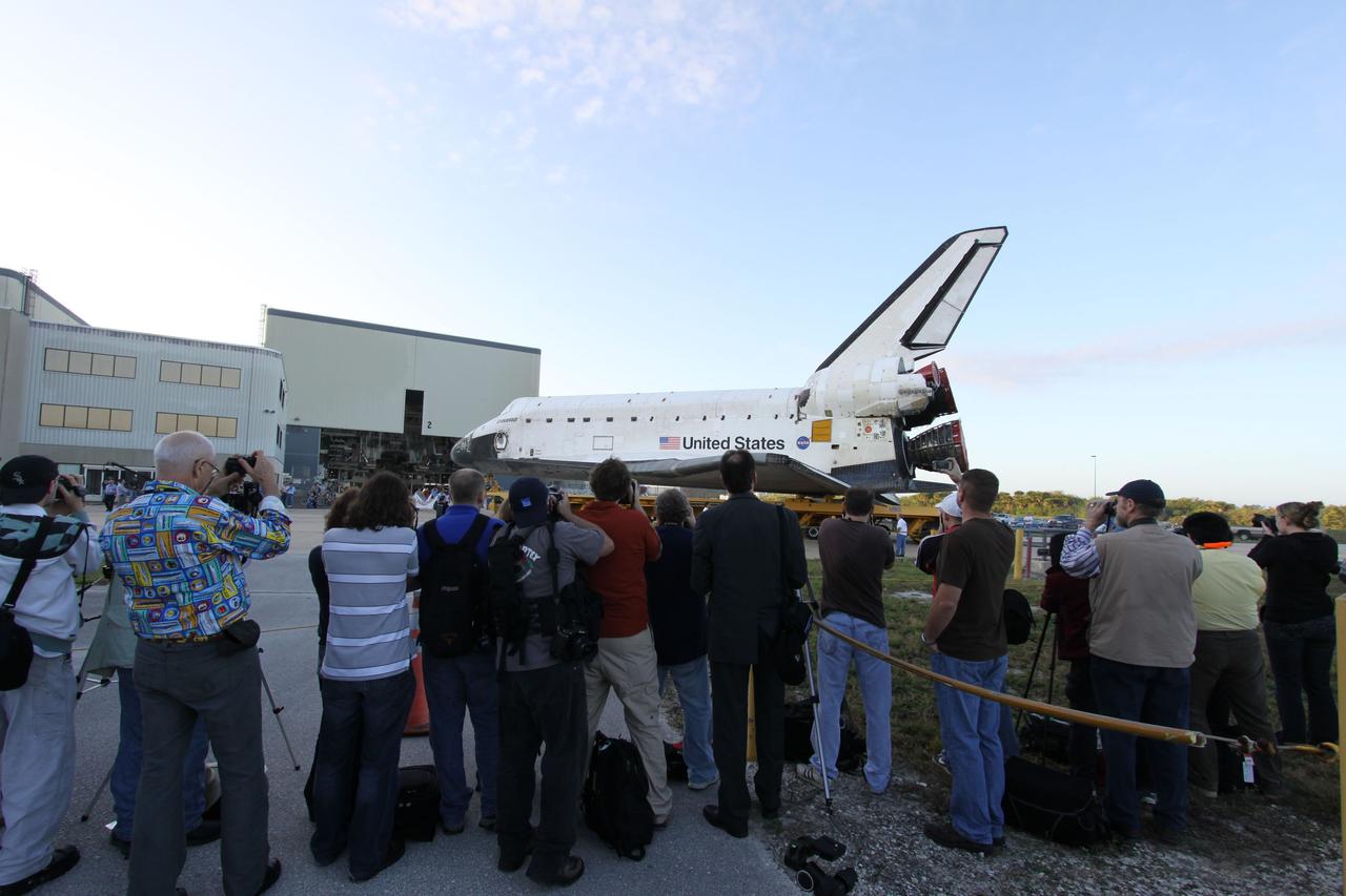 CAPE CANAVERAL, Fla. -- At NASA's Kennedy Space Center in Florida, media gather outside of Orbiter Processing Facility-2 to photograph space shuttle Endeavour's move, or "rollover," to the Vehicle Assembly Building (VAB). In the VAB, Endeavour will be lifted into a high bay where it will be attached to its external fuel tank and solid rocket boosters for its final and upcoming STS-134 mission.              Endeavour and its STS-134 crew will deliver the Express Logistics Carrier-3, Alpha Magnetic Spectrometer, spare parts, a high-pressure gas tank, additional spare parts for Dextre and micrometeoroid debris shields to the International Space Station. Launch is targeted for April 19 at 7:48 p.m. EDT. For more information visit, http://www.nasa.gov/mission_pages/shuttle/shuttlemissions/sts134/index.html. Photo credit: NASA