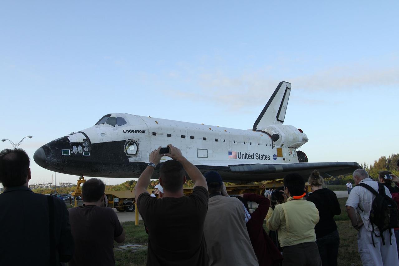 CAPE CANAVERAL, Fla. -- At NASA's Kennedy Space Center in Florida, media photograph space shuttle Endeavour's move, or "rollover," to the Vehicle Assembly Building (VAB) from Orbiter Processing Facility-2. In the VAB, Endeavour will be lifted into a high bay where it will be attached to its external fuel tank and solid rocket boosters for its final and upcoming STS-134 mission.            Endeavour and its STS-134 crew will deliver the Express Logistics Carrier-3, Alpha Magnetic Spectrometer, spare parts, a high-pressure gas tank, additional spare parts for Dextre and micrometeoroid debris shields to the International Space Station. Launch is targeted for April 19 at 7:48 p.m. EDT. For more information visit, http://www.nasa.gov/mission_pages/shuttle/shuttlemissions/sts134/index.html. Photo credit: NASA