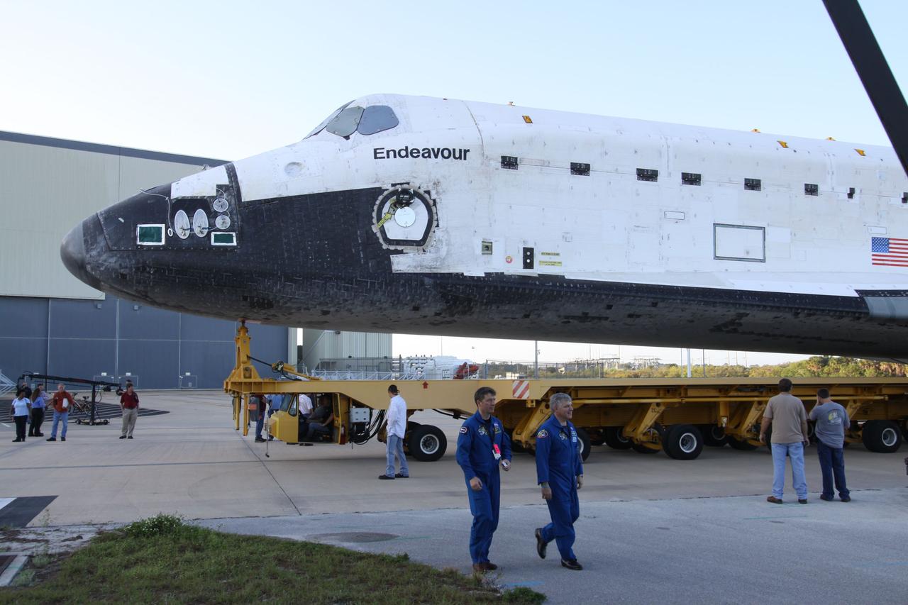 CAPE CANAVERAL, Fla. -- At NASA's Kennedy Space Center in Florida, STS-134 Pilot Gregory H. Johnson and Mission Specialist Roberto Vittori with the European Space Agency accompany space shuttle Endeavour's move, or "rollover," to the Vehicle Assembly Building (VAB). In the VAB, Endeavour will be lifted into a high bay where it will be attached to its external fuel tank and solid rocket boosters for its final and upcoming STS-134 mission.            Endeavour and its STS-134 crew will deliver the Express Logistics Carrier-3, Alpha Magnetic Spectrometer, spare parts, a high-pressure gas tank, additional spare parts for Dextre and micrometeoroid debris shields to the International Space Station. Launch is targeted for April 19 at 7:48 p.m. EDT. For more information visit, http://www.nasa.gov/mission_pages/shuttle/shuttlemissions/sts134/index.html. Photo credit: NASA
