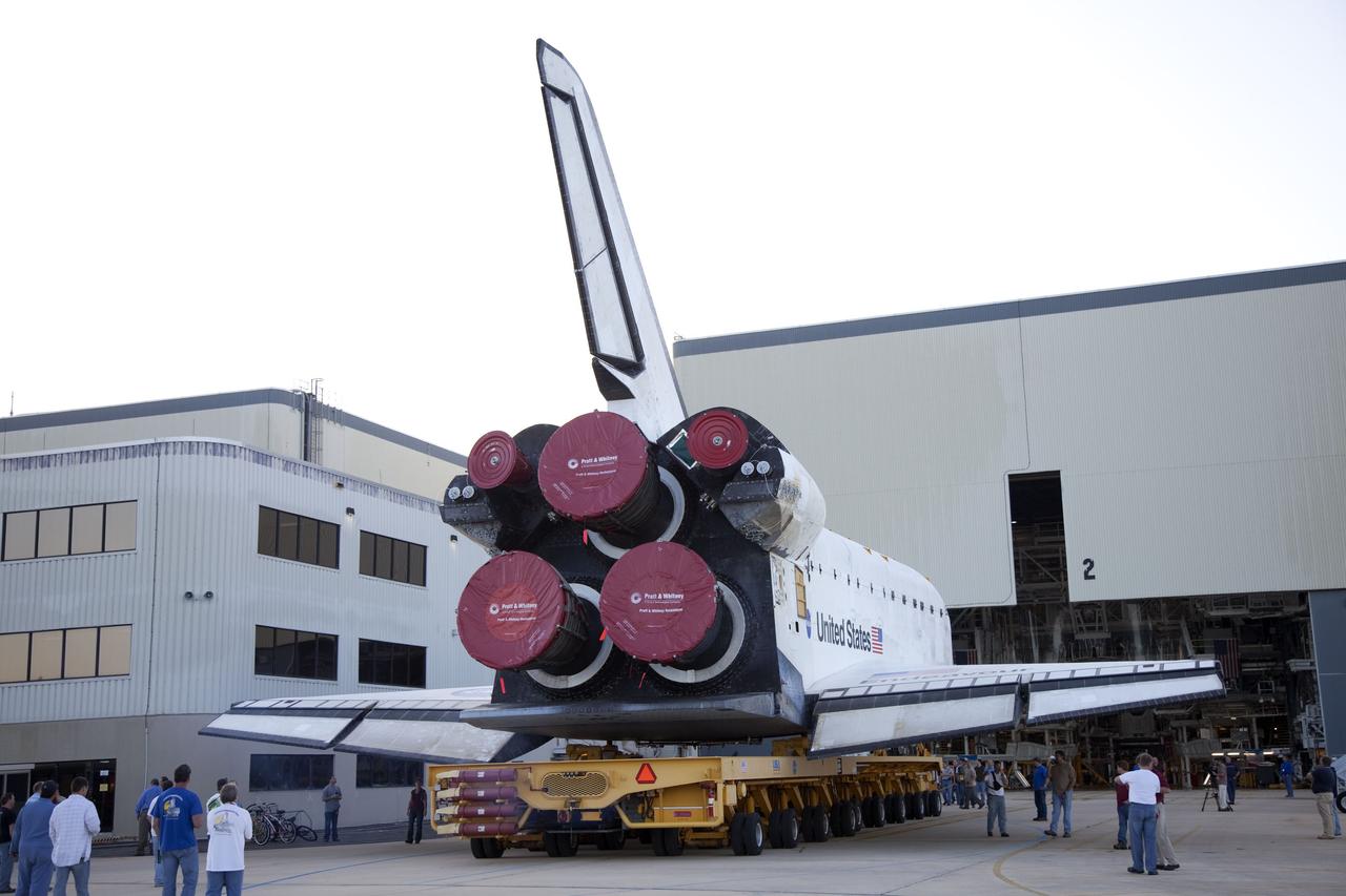 CAPE CANAVERAL, Fla. -- At NASA’s Kennedy Space Center in Florida, workers accompany space shuttle Endeavour as it is backed out of Orbiter Processing Facility-2 for its move, or "rollover," to the Vehicle Assembly Building. Endeavour and its STS-134 crew will deliver the Express Logistics Carrier-3, Alpha Magnetic Spectrometer, spare parts, a high-pressure gas tank, additional spare parts for Dextre and micrometeoroid debris shields to the International Space Station. Launch is targeted for April 19 at 7:48 p.m. EDT. For more information visit, http://www.nasa.gov/mission_pages/shuttle/shuttlemissions/sts134/index.html. Photo credit: NASA/Frankie Martin