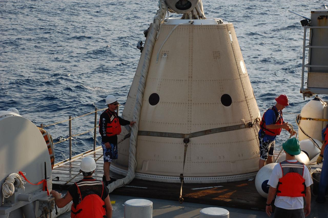 CAPE CANAVERAL, Fla. -- Crew members from Freedom Star, one of NASA's solid rocket booster retrieval ships, have recovered and secured the left spent booster nose cap to a pallet on the ship's deck after space shuttle Discovery's STS-133 launch.          The shuttle’s two solid rocket booster casings and associated flight hardware are recovered in the Atlantic Ocean after every launch by Liberty Star and Freedom Star. The boosters impact the Atlantic about seven minutes after liftoff and the retrieval ships are stationed about 10 miles from the impact area at the time of splashdown. After the spent segments are processed, they will be transported to Utah, where they will be refurbished and stored, if needed. Photo credit: NASA/Ben Smegelsky