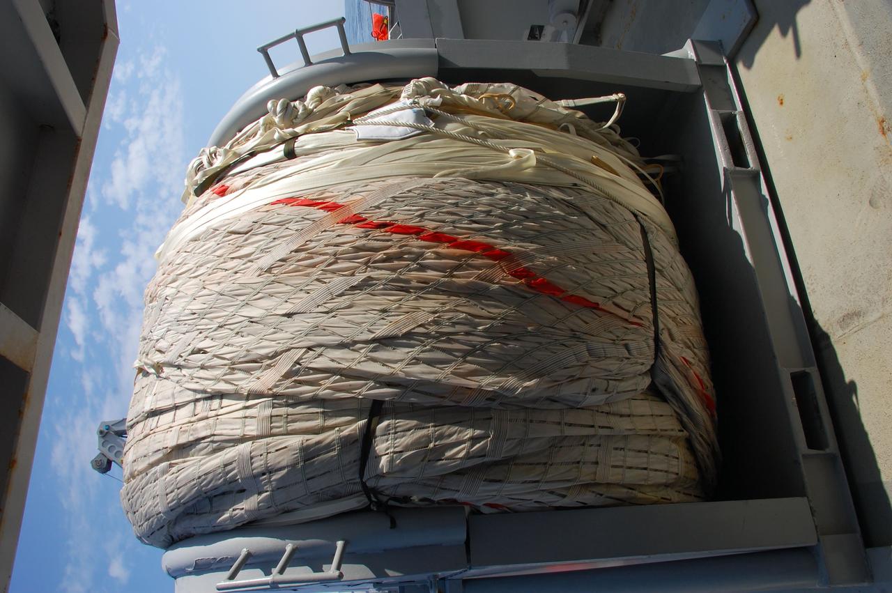 CAPE CANAVERAL, Fla. -- The massive parachute from the left spent booster is rolled up on the deck of Freedom Star, one of NASA's solid rocket booster retrieval ships, after recovery from the Atlantic Ocean and will be returned to Port Canaveral in Florida.        The shuttle’s two solid rocket booster casings and associated flight hardware are recovered in the Atlantic Ocean after every launch by Liberty Star and Freedom Star. The boosters impact the Atlantic about seven minutes after liftoff and the retrieval ships are stationed about 10 miles from the impact area at the time of splashdown. After the spent segments are processed, they will be transported to Utah, where they will be refurbished and stored, if needed. Photo credit: NASA/Ben Smegelsky