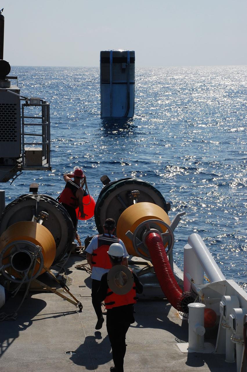 CAPE CANAVERAL, Fla. -- Freedom Star, one of NASA's solid rocket booster retrieval ships, and its crew are preparing to recover the left spent booster from the Atlantic Ocean. The round objects on deck are large pumping machines that will be attached to the booster by a hose that will blow out debris and water and then pump in air so the booster can float horizontally on the water's surface for towing back to Port Canaveral in Florida.            The shuttle’s two solid rocket booster casings and associated flight hardware are recovered in the Atlantic Ocean after every launch by Liberty Star and Freedom Star. The boosters impact the Atlantic about seven minutes after liftoff and the retrieval ships are stationed about 10 miles from the impact area at the time of splashdown. After the spent segments are processed, they will be transported to Utah, where they will be refurbished and stored, if needed. Photo credit: NASA/Ben Smegelsky