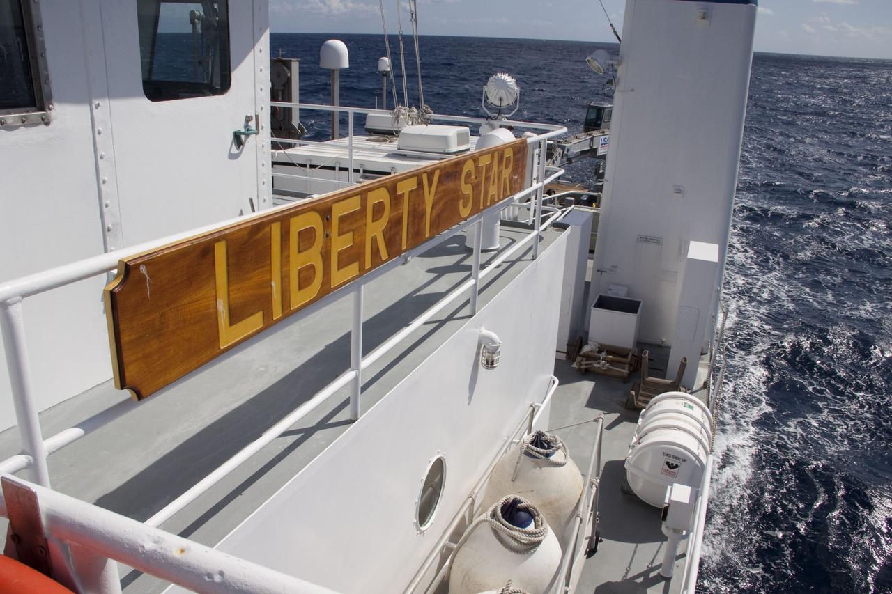 CAPE CANAVERAL, Fla. -- An expanse of ocean is seen on the horizon as Liberty Star, one of NASA's solid rocket booster retrieval ships, set sail to be in position in the Atlantic Ocean to recover the right spent booster that splashed down after space shuttle Discovery's final launch. The shuttle’s two solid rocket booster casings and associated flight hardware are recovered in the Atlantic Ocean after every launch by Freedom Star and Liberty Star. The boosters impact the Atlantic about seven minutes after liftoff and the retrieval ships are stationed about 10 miles from the impact area at the time of splashdown. After the spent segments are processed, they will be transported to Utah, where they will be refurbished and stored, if needed. Photo credit: NASA/Frank Michaux