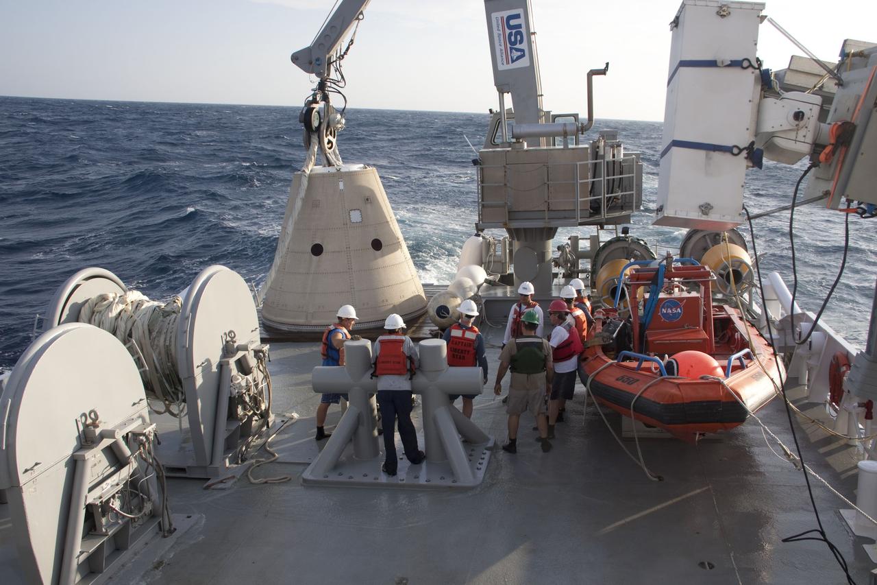 CAPE CANAVERAL, Fla. -- Crew members from Liberty Star, one of NASA's solid rocket booster retrieval ships, have recovered and secured the right spent booster nose cap to a pallet on the ship's deck that was recovered from the Atlantic Ocean after Discovery's final launch.        The shuttle’s two solid rocket booster casings and associated flight hardware are recovered in the Atlantic Ocean after every launch by Freedom Star and Liberty Star. The boosters impact the Atlantic about seven minutes after liftoff and the retrieval ships are stationed about 10 miles from the impact area at the time of splashdown. After the spent segments are processed, they will be transported to Utah, where they will be refurbished and stored, if needed. Photo credit: NASA/Frank Michaux