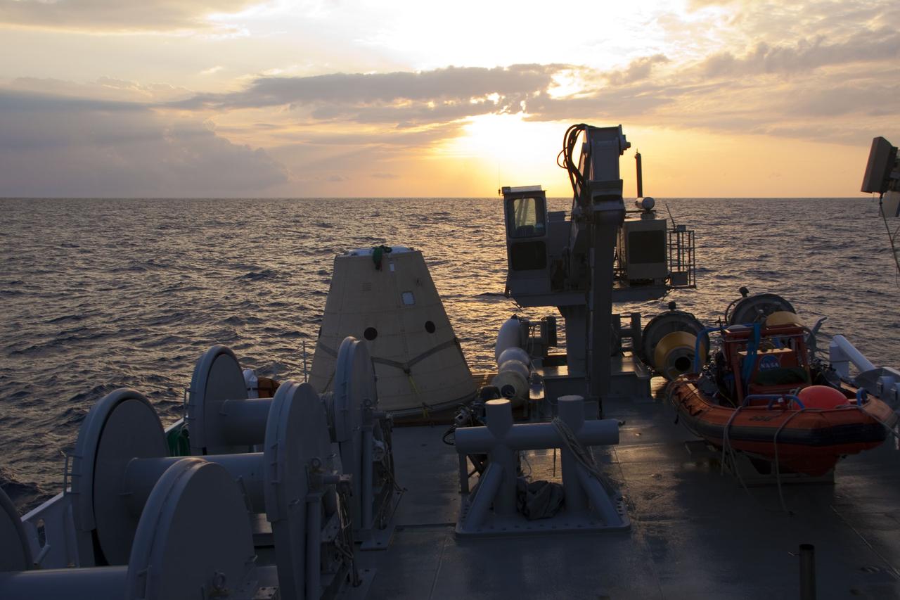 CAPE CANAVERAL, Fla. -- The sun dawns over the Atlantic Ocean and Liberty Star, one of NASA's solid rocket booster retrieval ships, stationed in the Atlantic Ocean, to recover the right spent booster after it splashed down following space shuttle Discovery's final launch.          The shuttle’s two solid rocket booster casings and associated flight hardware are recovered in the Atlantic Ocean after every launch by Freedom Star and Liberty Star. The boosters impact the Atlantic about seven minutes after liftoff and the retrieval ships are stationed about 10 miles from the impact area at the time of splashdown. After the spent segments are processed, they will be transported to Utah, where they will be refurbished and stored, if needed. Photo credit: NASA/Frank Michaux
