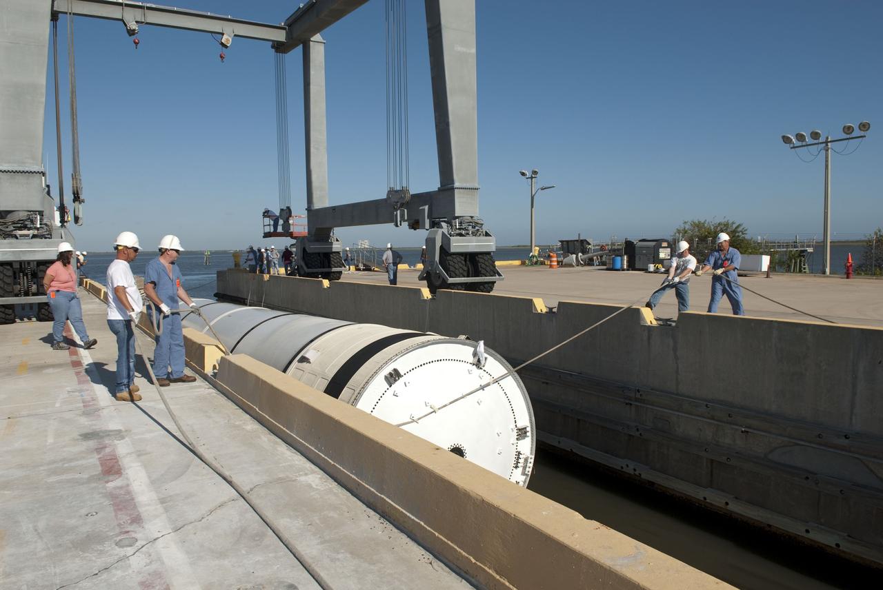 CAPE CANAVERAL, Fla. -- One of the solid rocket boosters used during space shuttle Discovery's STS-133 launch is unloaded onto a hoisting slip at the Solid Rocket Booster Disassembly Facility at Hangar AF on Cape Canaveral Air Force Station in Florida. Following the launch from NASA Kennedy Space Center's Launch Pad 39A on Feb. 24, the shuttle's two boosters fell into the Atlantic Ocean. There, the booster casings and associated flight hardware were recovered by Liberty Star and Freedom Star. The boosters impact the Atlantic about seven minutes after liftoff and the retrieval ships are stationed about 10 miles from the impact area at the time of splashdown. After the spent segments are processed, they will be transported to Utah, where they will be refurbished and stored, if needed. Photo credit: NASA/Jim Grossmann