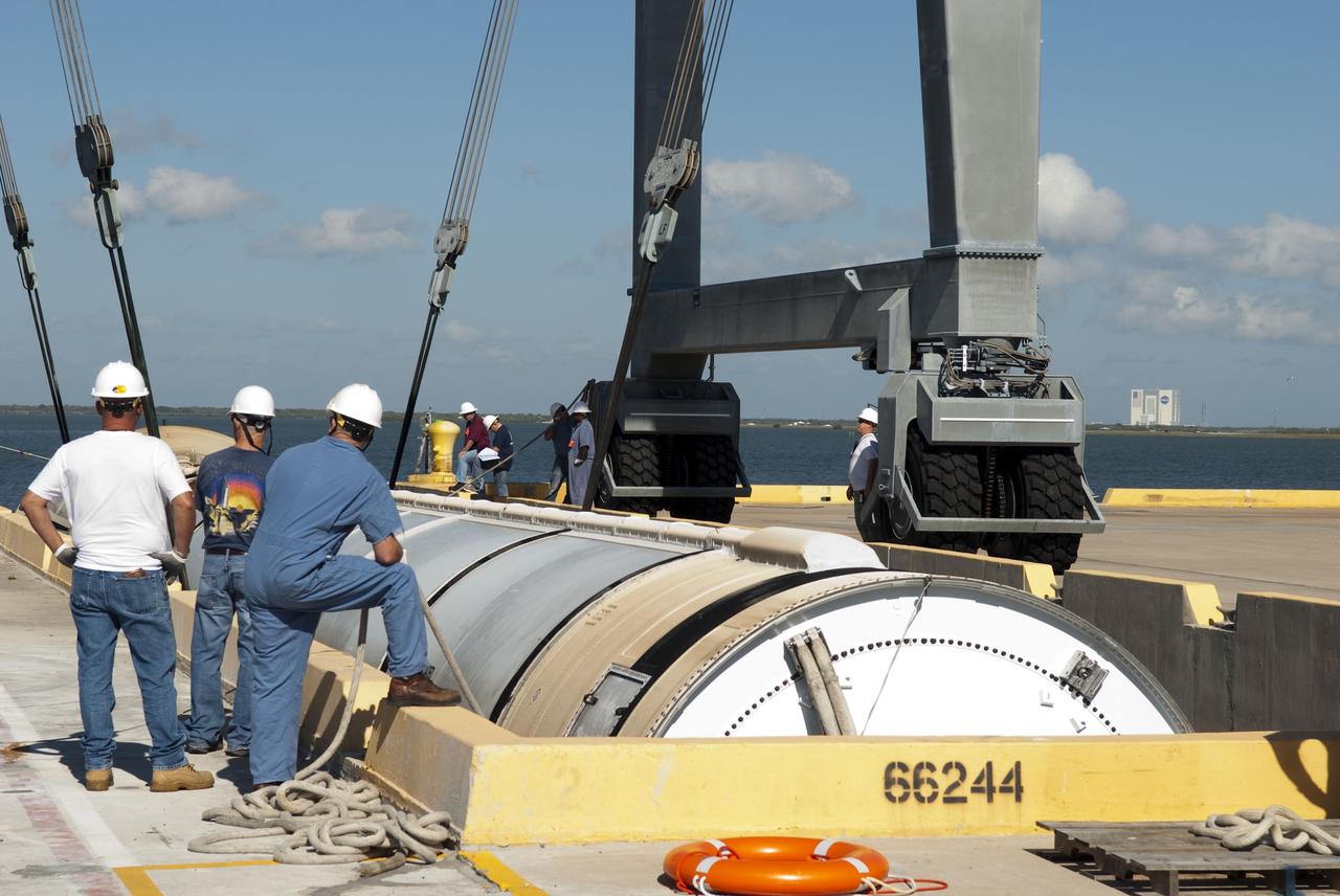 CAPE CANAVERAL, Fla. -- One of the solid rocket boosters used during space shuttle Discovery's STS-133 launch is unloaded onto a hoisting slip at the Solid Rocket Booster Disassembly Facility at Hangar AF on Cape Canaveral Air Force Station in Florida. Following the launch from NASA Kennedy Space Center's Launch Pad 39A on Feb. 24, the shuttle's two boosters fell into the Atlantic Ocean. There, the booster casings and associated flight hardware were recovered by Liberty Star and Freedom Star. The boosters impact the Atlantic about seven minutes after liftoff and the retrieval ships are stationed about 10 miles from the impact area at the time of splashdown. After the spent segments are processed, they will be transported to Utah, where they will be refurbished and stored, if needed. Photo credit: NASA/Jim Grossmann