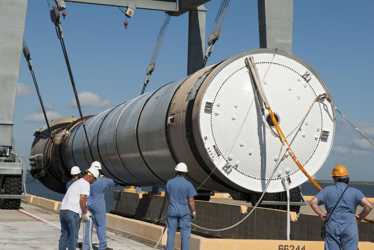 CAPE CANAVERAL, Fla. -- One of the solid rocket boosters used during space shuttle Discovery's STS-133 launch is unloaded onto a hoisting slip at the Solid Rocket Booster Disassembly Facility at Hangar AF on Cape Canaveral Air Force Station in Florida. Following the launch from NASA Kennedy Space Center's Launch Pad 39A on Feb. 24, the shuttle's two boosters fell into the Atlantic Ocean. There, the booster casings and associated flight hardware were recovered by Liberty Star and Freedom Star. The boosters impact the Atlantic about seven minutes after liftoff and the retrieval ships are stationed about 10 miles from the impact area at the time of splashdown. After the spent segments are processed, they will be transported to Utah, where they will be refurbished and stored, if needed. Photo credit: NASA/Jim Grossmann