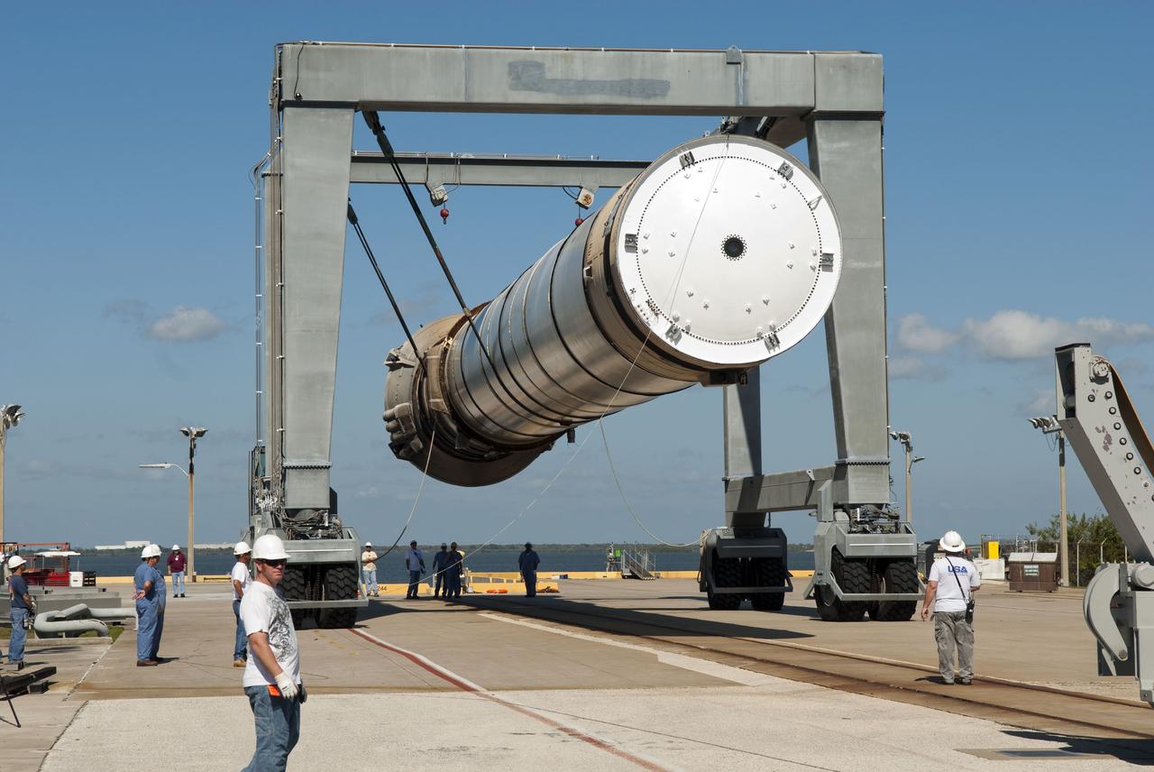 CAPE CANAVERAL, Fla. -- One of the solid rocket boosters used during space shuttle Discovery's STS-133 launch is unloaded onto a hoisting slip at the Solid Rocket Booster Disassembly Facility at Hangar AF on Cape Canaveral Air Force Station in Florida. Following the launch from NASA Kennedy Space Center's Launch Pad 39A on Feb. 24, the shuttle's two boosters fell into the Atlantic Ocean. There, the booster casings and associated flight hardware were recovered by Liberty Star and Freedom Star. The boosters impact the Atlantic about seven minutes after liftoff and the retrieval ships are stationed about 10 miles from the impact area at the time of splashdown. After the spent segments are processed, they will be transported to Utah, where they will be refurbished and stored, if needed. Photo credit: NASA/Jim Grossmann