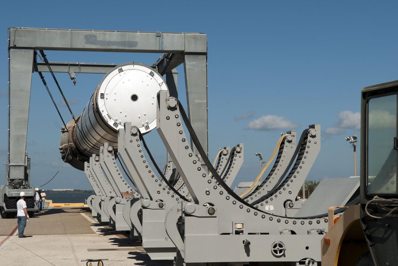CAPE CANAVERAL, Fla. -- At the Solid Rocket Booster Disassembly Facility at Hangar AF on Cape Canaveral Air Force Station in Florida, one of the solid rocket boosters used during space shuttle Discovery's STS-133 launch is moved to a tracked dolly for processing. Following the launch from NASA Kennedy Space Center's Launch Pad 39A on Feb. 24, the shuttle's two boosters fell into the Atlantic Ocean. There, the booster casings and associated flight hardware were recovered by Liberty Star and Freedom Star.        The boosters impact the Atlantic about seven minutes after liftoff and the retrieval ships are stationed about 10 miles from the impact area at the time of splashdown.  After the spent segments are processed, they will be transported to Utah, where they will be refurbished and stored, if needed. Photo credit: NASA/Jim Grossmann