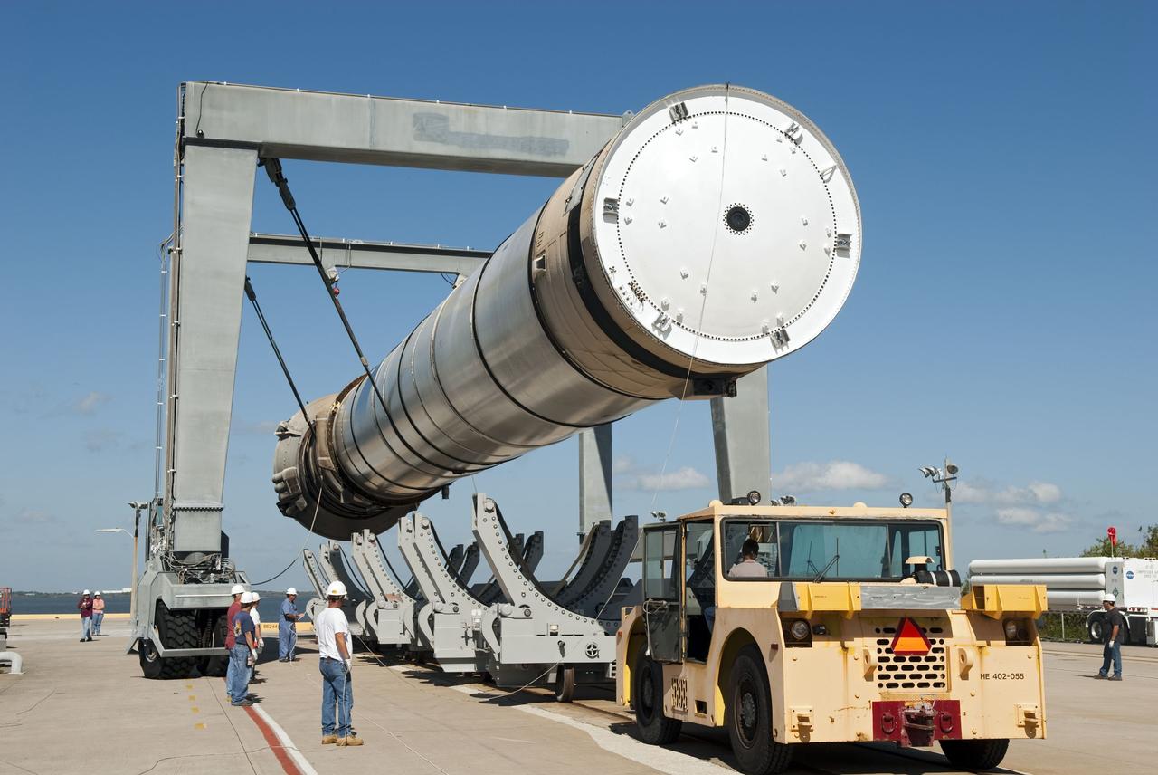 CAPE CANAVERAL, Fla. -- At the Solid Rocket Booster Disassembly Facility at Hangar AF on Cape Canaveral Air Force Station in Florida, one of the solid rocket boosters used during space shuttle Discovery's STS-133 launch is moved to a tracked dolly for processing. Following the launch from NASA Kennedy Space Center's Launch Pad 39A on Feb. 24, the shuttle's two boosters fell into the Atlantic Ocean. There, the booster casings and associated flight hardware were recovered by Liberty Star and Freedom Star.          The boosters impact the Atlantic about seven minutes after liftoff and the retrieval ships are stationed about 10 miles from the impact area at the time of splashdown.  After the spent segments are processed, they will be transported to Utah, where they will be refurbished and stored, if needed. Photo credit: NASA/Jim Grossmann