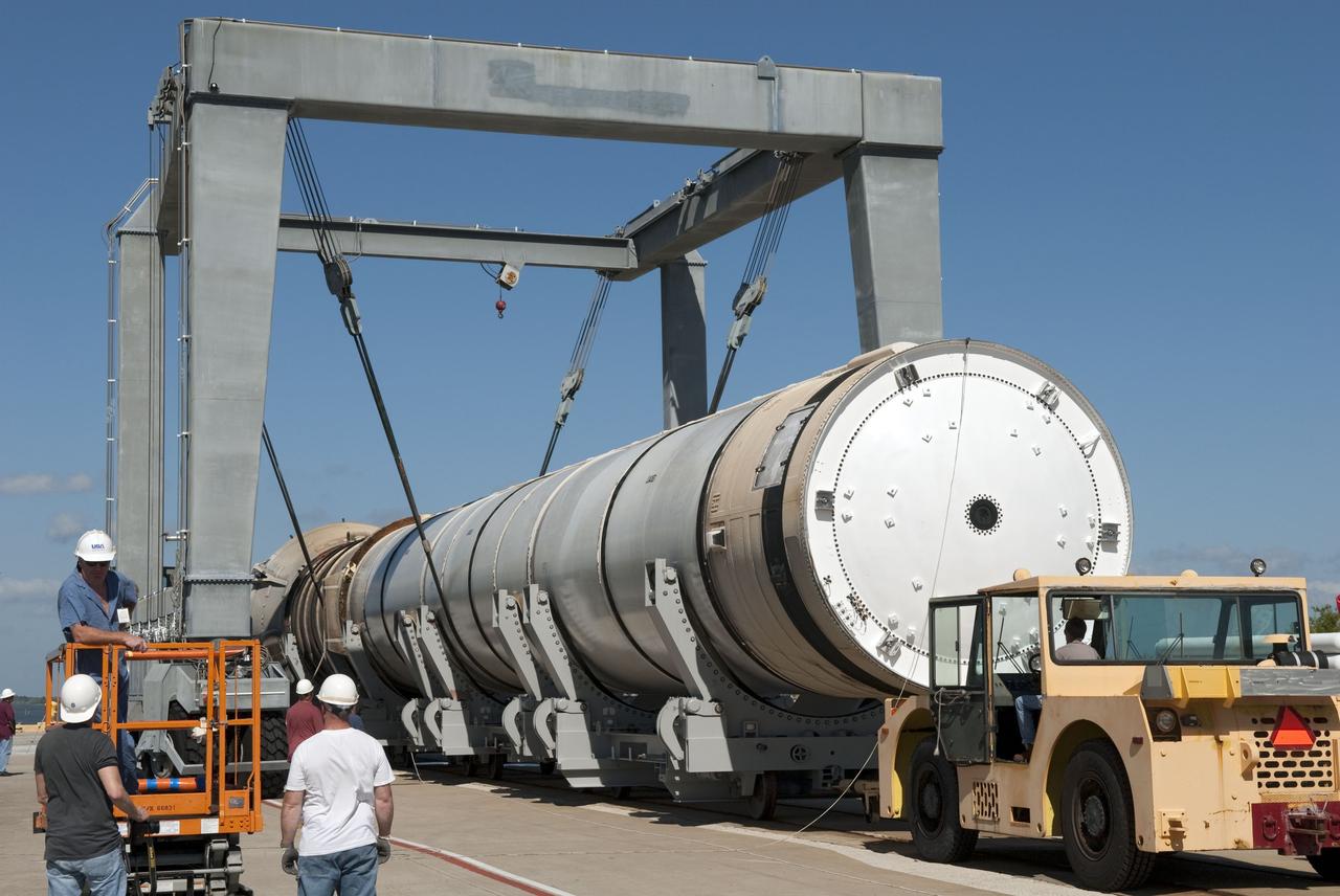 CAPE CANAVERAL, Fla. -- At the Solid Rocket Booster Disassembly Facility at Hangar AF on Cape Canaveral Air Force Station in Florida, one of the solid rocket boosters used during space shuttle Discovery's STS-133 launch is moved to a tracked dolly for processing. Following the launch from NASA Kennedy Space Center's Launch Pad 39A on Feb. 24, the shuttle's two boosters fell into the Atlantic Ocean. There, the booster casings and associated flight hardware were recovered by Liberty Star and Freedom Star.        The boosters impact the Atlantic about seven minutes after liftoff and the retrieval ships are stationed about 10 miles from the impact area at the time of splashdown.  After the spent segments are processed, they will be transported to Utah, where they will be refurbished and stored, if needed. Photo credit: NASA/Jim Grossmann