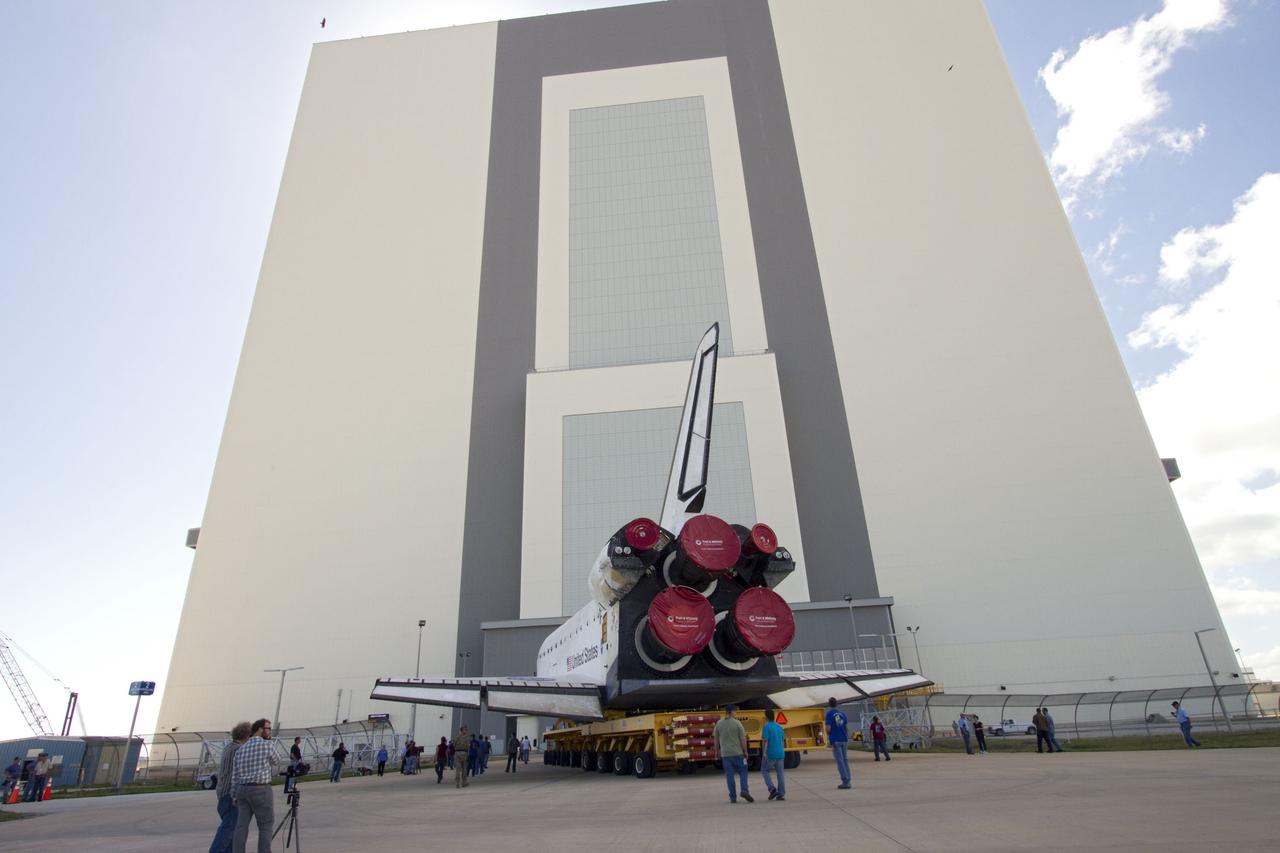 CAPE CANAVERAL, Fla. -- At NASA's Kennedy Space Center in Florida, space shuttle Endeavour approaches the Vehicle Assembly Building, or VAB, on its move from Orbiter Processing Facility-2 where it was processed for its final mission, STS-134. In the VAB, Endeavour will be lifted into a high bay where it will be joined to its external fuel tank and solid rocket boosters.      Endeavour and its STS-134 crew will deliver the Express Logistics Carrier-3, Alpha Magnetic Spectrometer, a high-pressure gas tank, additional spare parts for Dextre and micrometeoroid debris shields to the International Space Station. Launch is targeted for April 19 at 7:48 p.m. EDT. For more information visit, http://www.nasa.gov/mission_pages/shuttle/shuttlemissions/sts134/index.html. Photo credit: NASA/Jack Pfaller