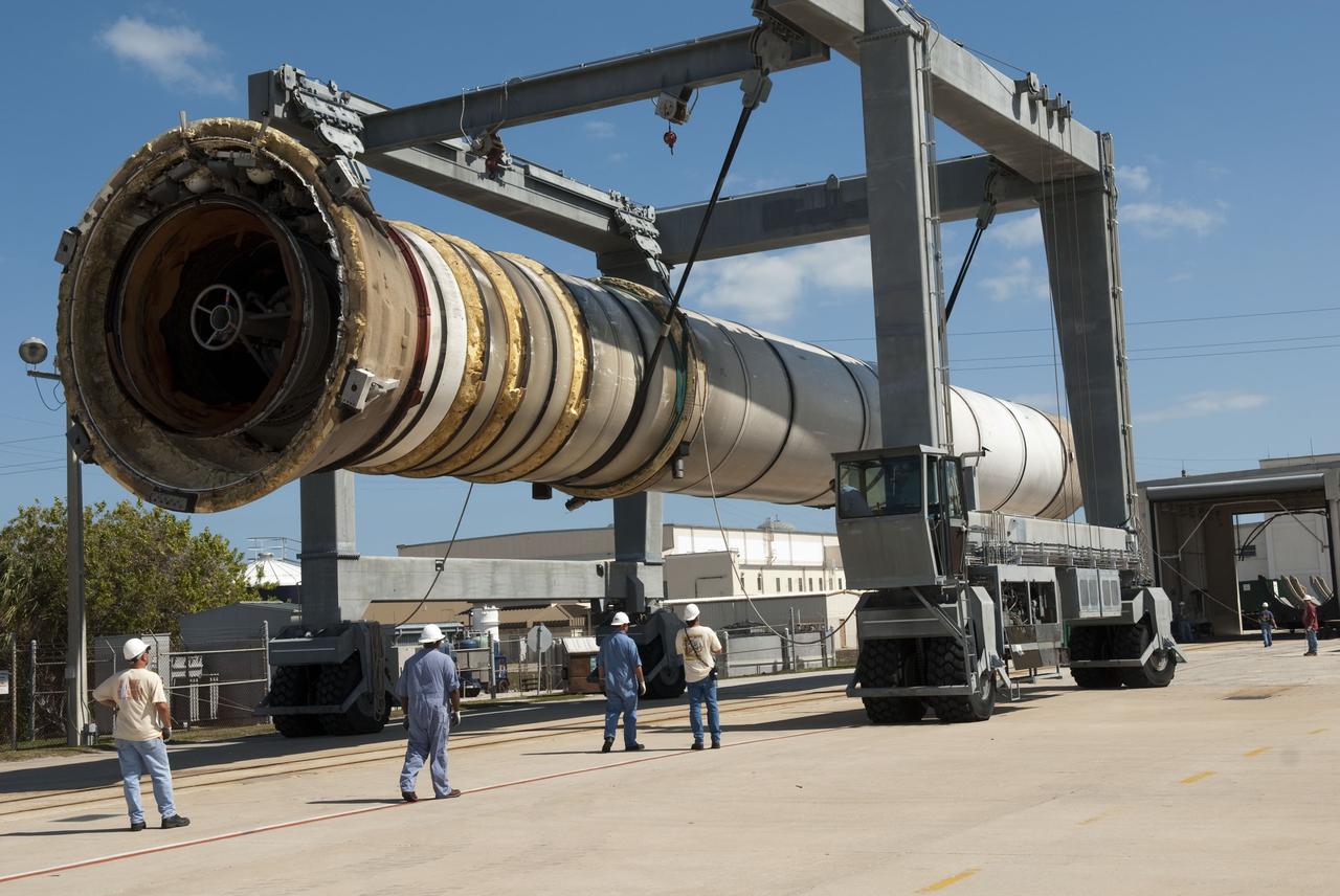 CAPE CANAVERAL, Fla. -- The left spent booster used during space shuttle Discovery's final launch hangs in a hoisting device at the Solid Rocket Booster Disassembly Facility at Hangar AF on Cape Canaveral Air Force Station in Florida. The shuttle's two solid rocket booster casings and associated flight hardware are recovered in the Atlantic Ocean after every launch by Freedom Star and Liberty Star. The boosters impact the Atlantic about seven minutes after liftoff and the retrieval ships are stationed about 10 miles from the impact area at the time of splashdown. After the spent segments are processed, they will be transported to Utah, where they will be refurbished and stored, if needed. Photo credit: NASA/Jim Grossmann